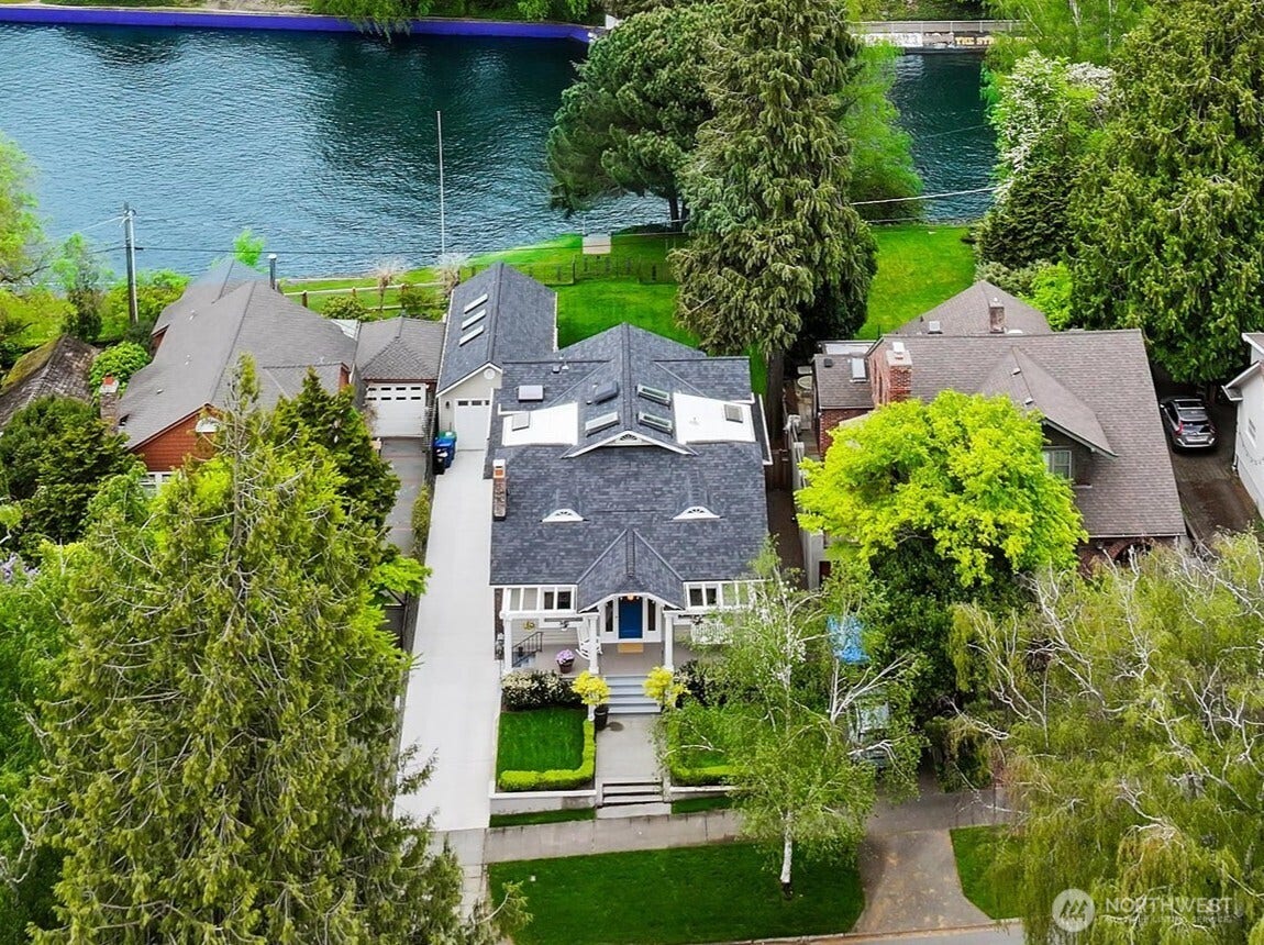 This is Seattle waterfront living at its finesttimeless architecture, modern updates, and a front-row seat to Montlake Cut