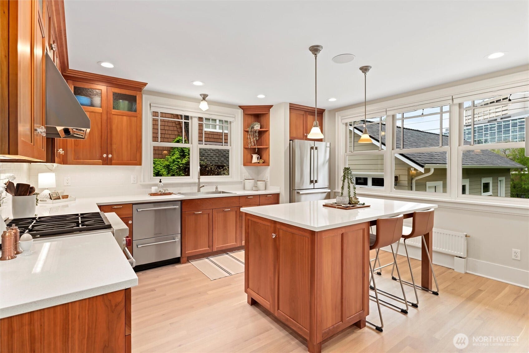 True chefs kitchen with elegant marble countertops & high-end Bosch, Fisher & Paykel, and Wolf appliances