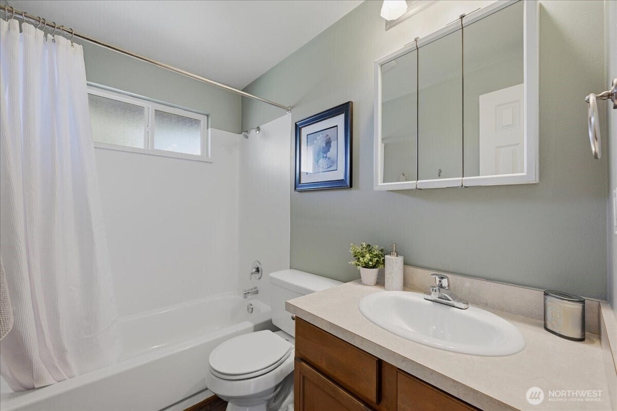 20807 3rd Avenue W, Lynnwood, WA 98036 Fresh, functional full bath with a tub/shower combination, generous vanity space and a mirrored medicine cabinet offering convenient storage