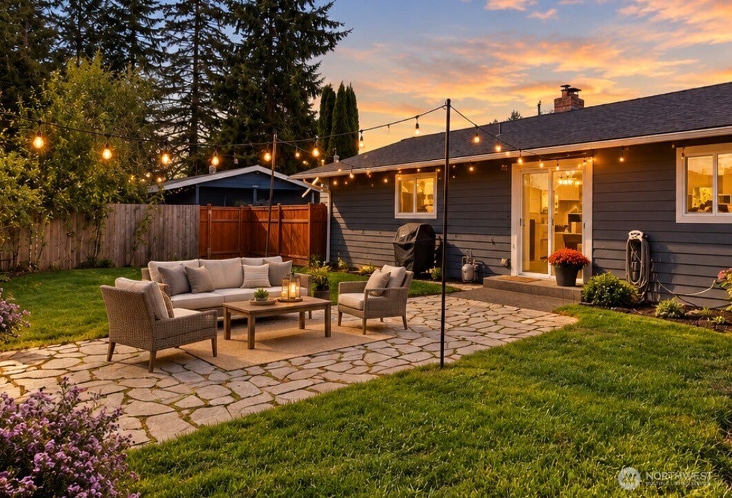 20807 3rd Avenue W, Lynnwood, WA 98036 Enhanced twilight view showcasing the bistro lights and inviting setting for outdoor relaxing. Virtually staged for inspiration!