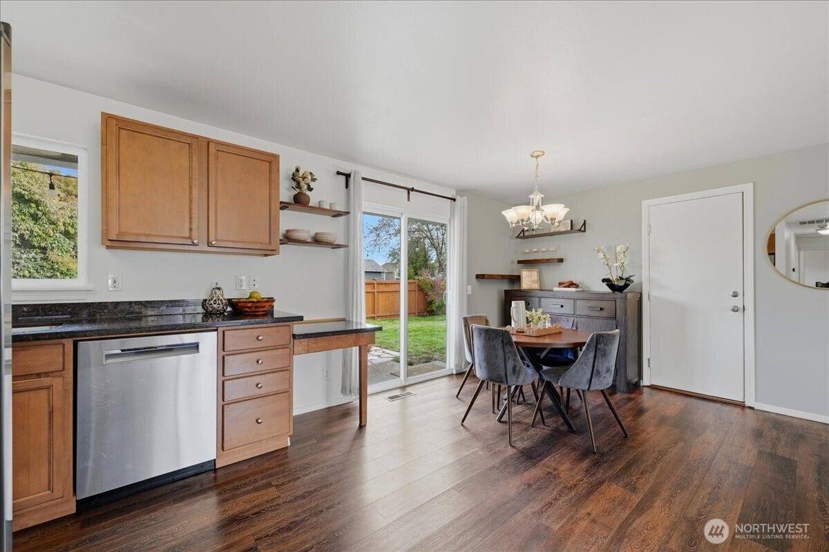 20807 3rd Avenue W, Lynnwood, WA 98036 Open kitchen and dining space, with sliding-door access to the backyard