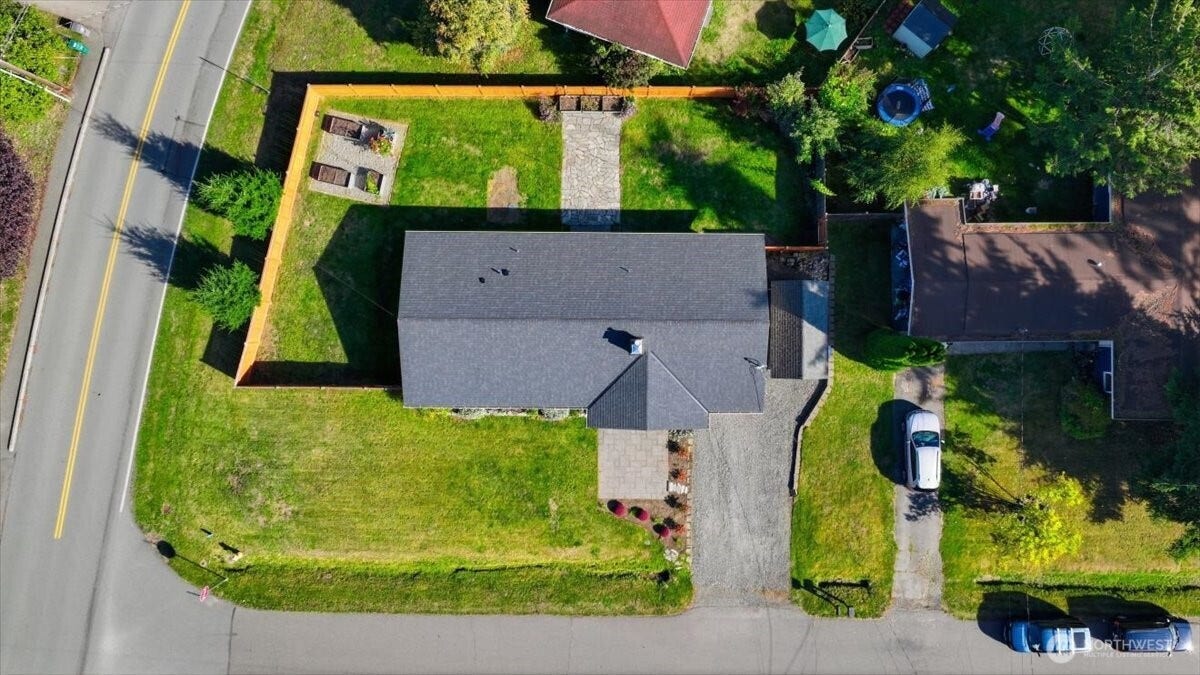 20807 3rd Avenue W, Lynnwood, WA 98036 Spacious corner lot with a fully fenced yard, charming flagstone patio and raised garden beds for easy outdoor living
