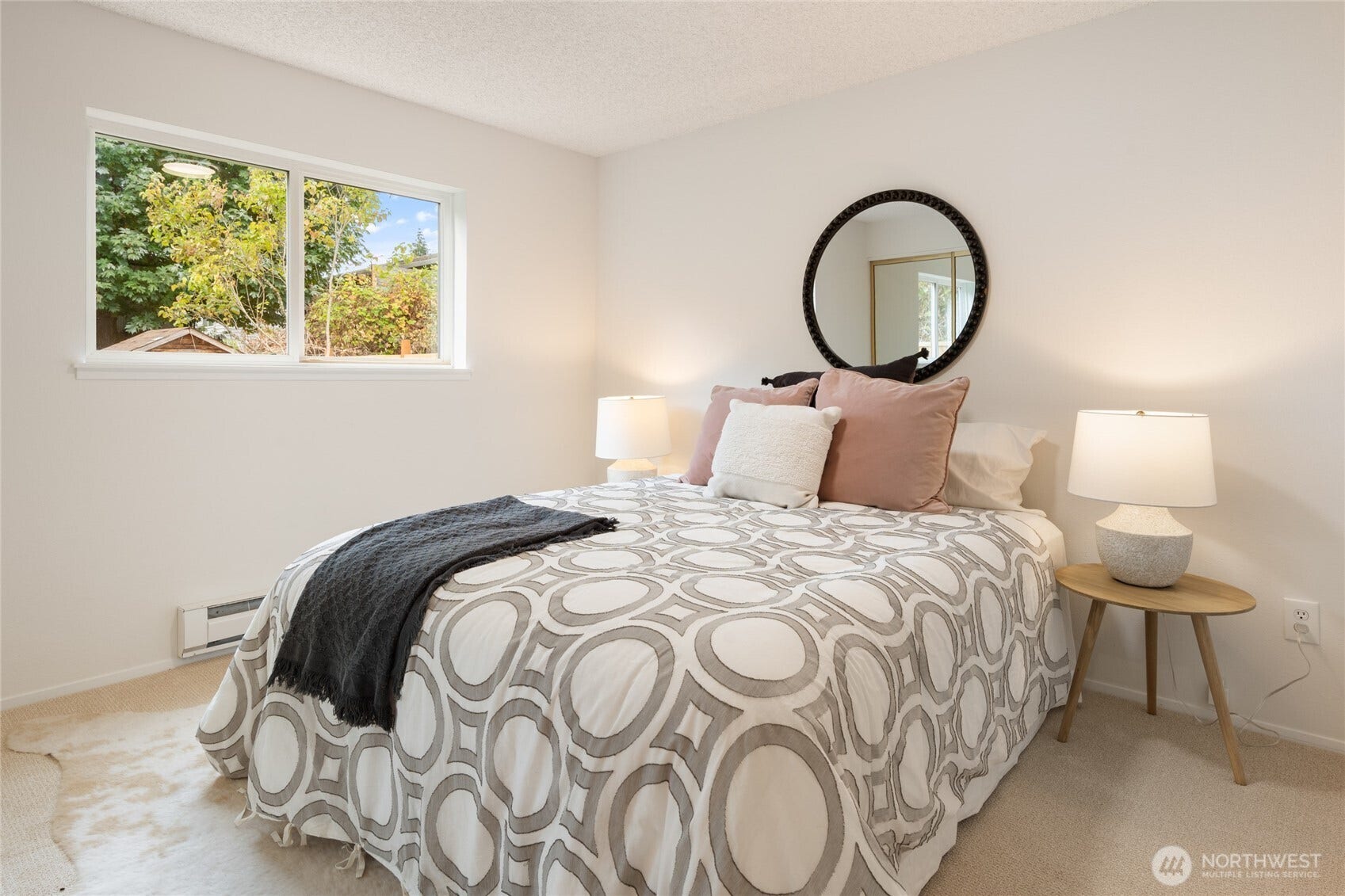 Bedroom #3 looks onto the private side yard.