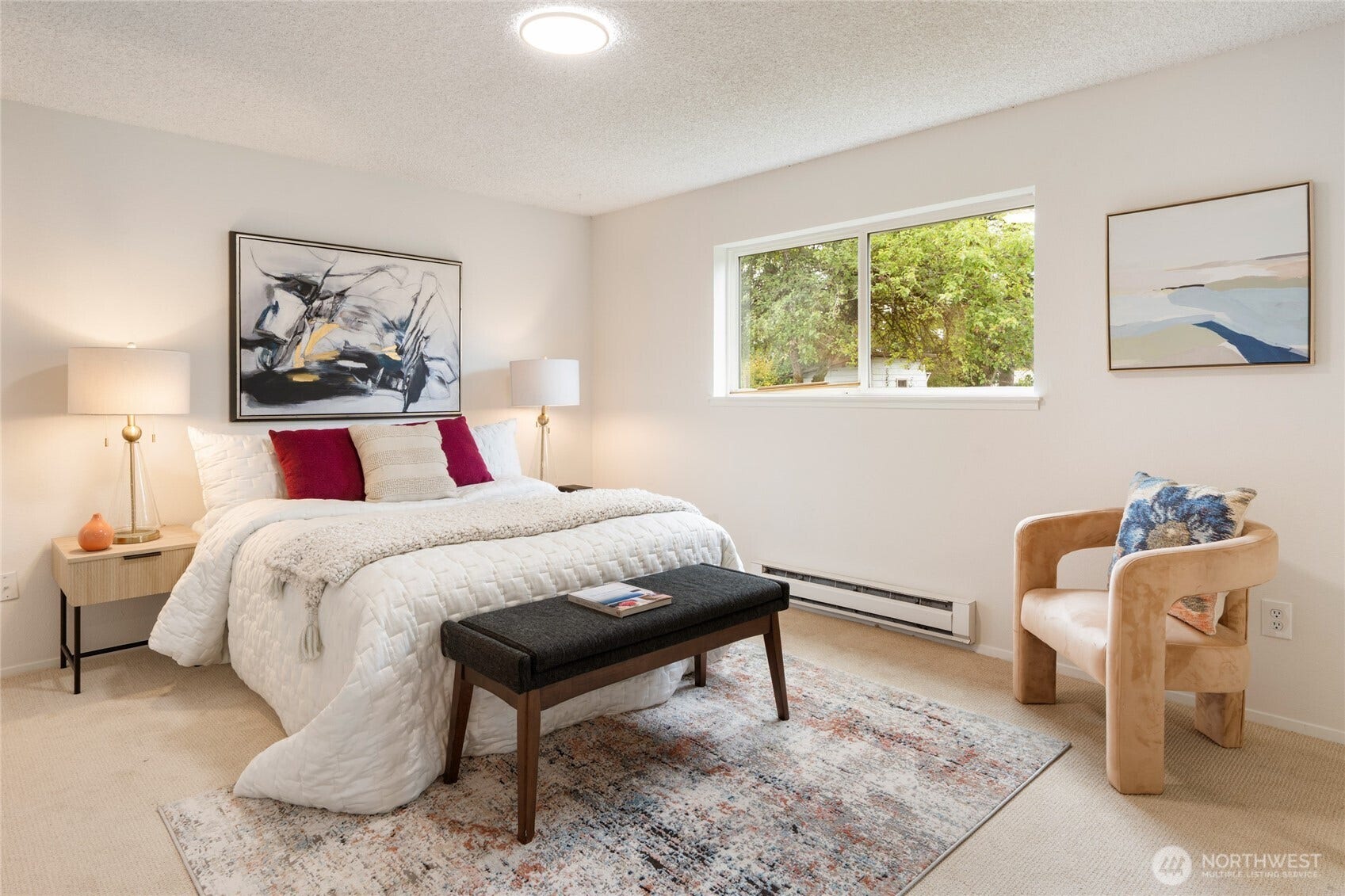 Primary bedroom includes freshly painted walls, updated ensuite bathroom, large closet and looks onto recently redone backyard.
