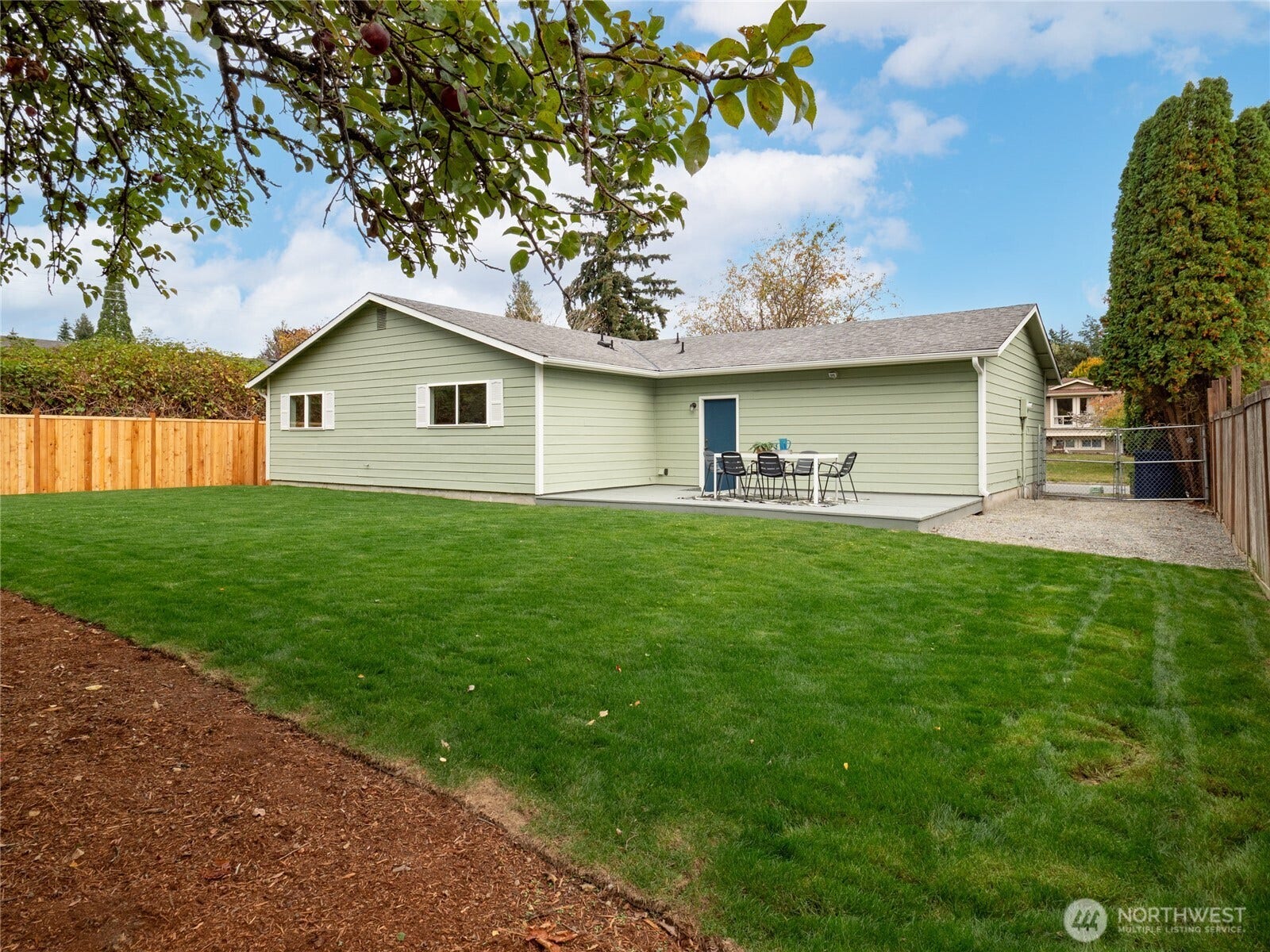 Rare, large level backyard with new sod and bark.
