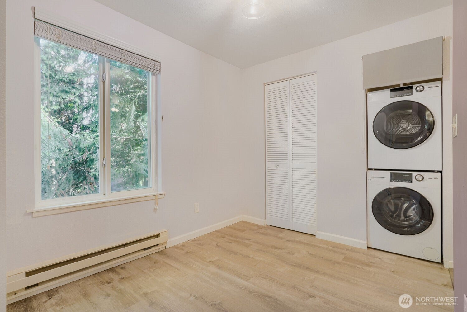 Dining room area with laundry closet