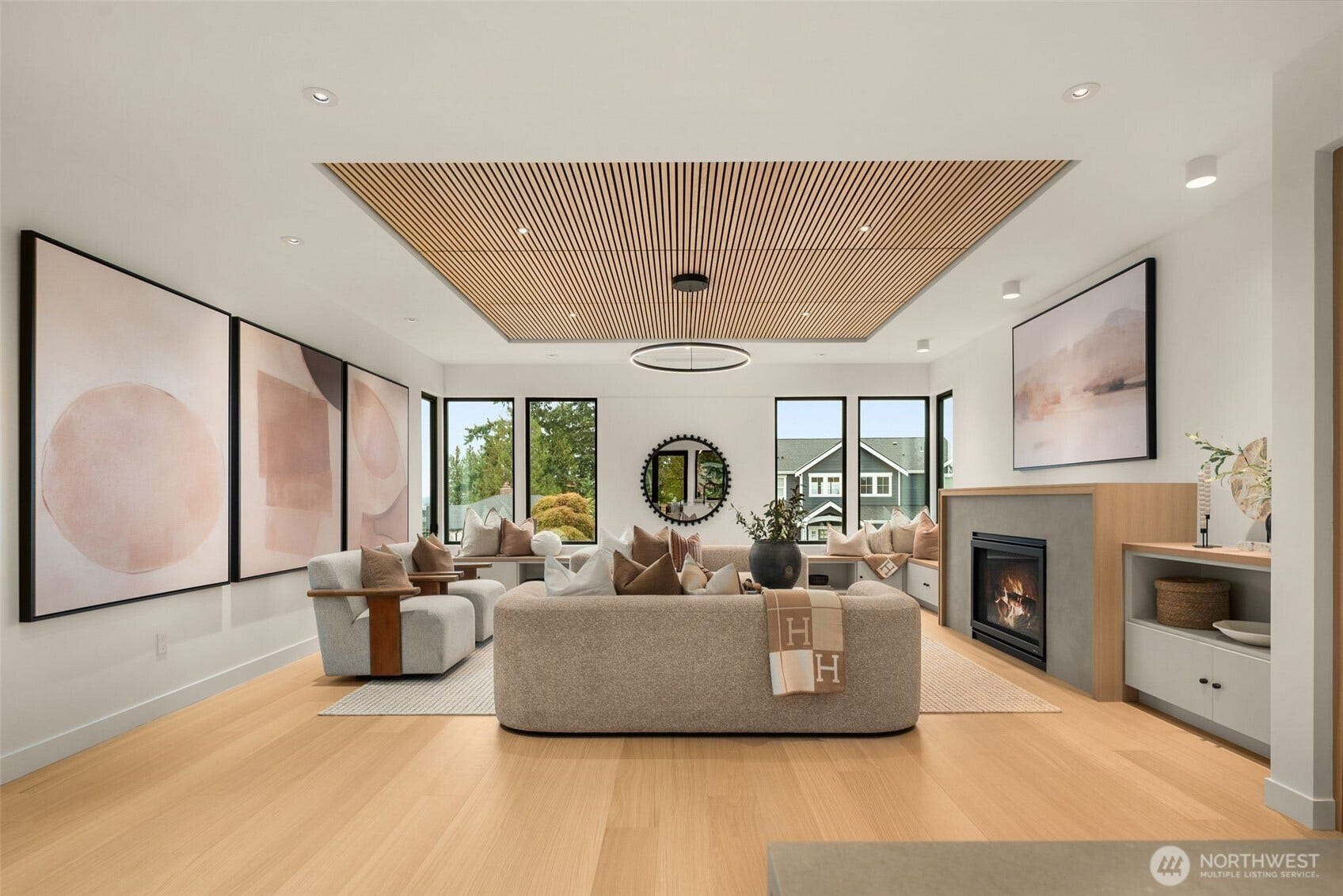 6021 Princeton Avenue NE, Seattle, WA 98115 Warm and sophisticated living room with wood-accented ceiling and true gas fireplace.