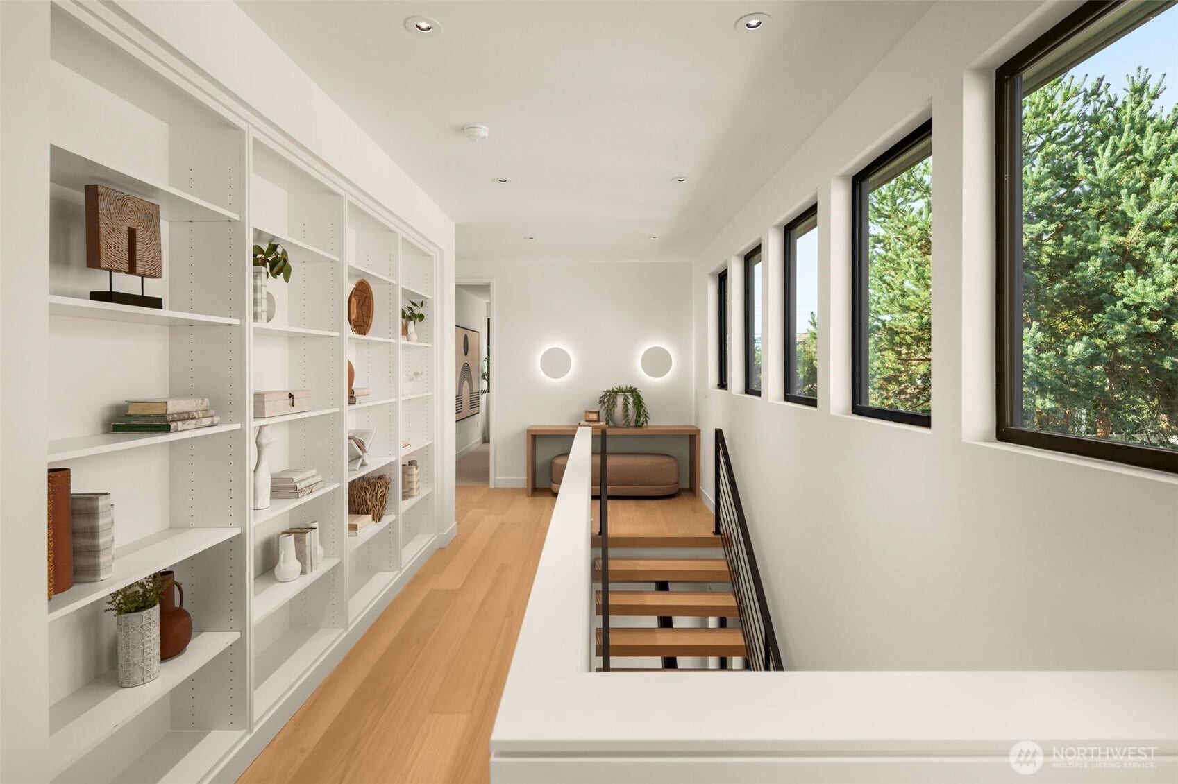 6021 Princeton Avenue NE, Seattle, WA 98115 A wall of windows and well-placed built-ins welcome you upstairs.