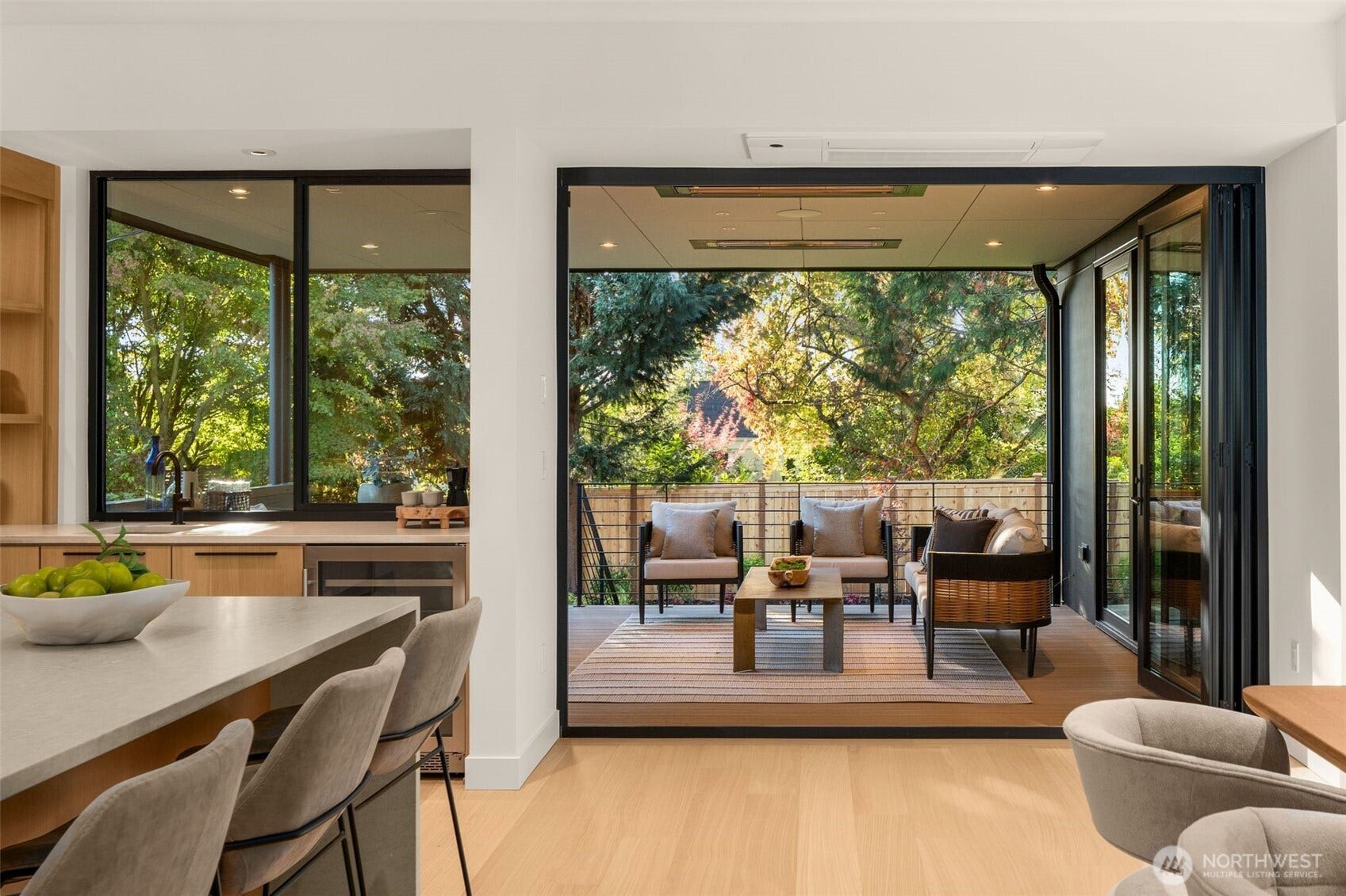 6021 Princeton Avenue NE, Seattle, WA 98115 The walls of glass open to the outside, along with a pass-through window providing the ultimate indoor-outdoor space.