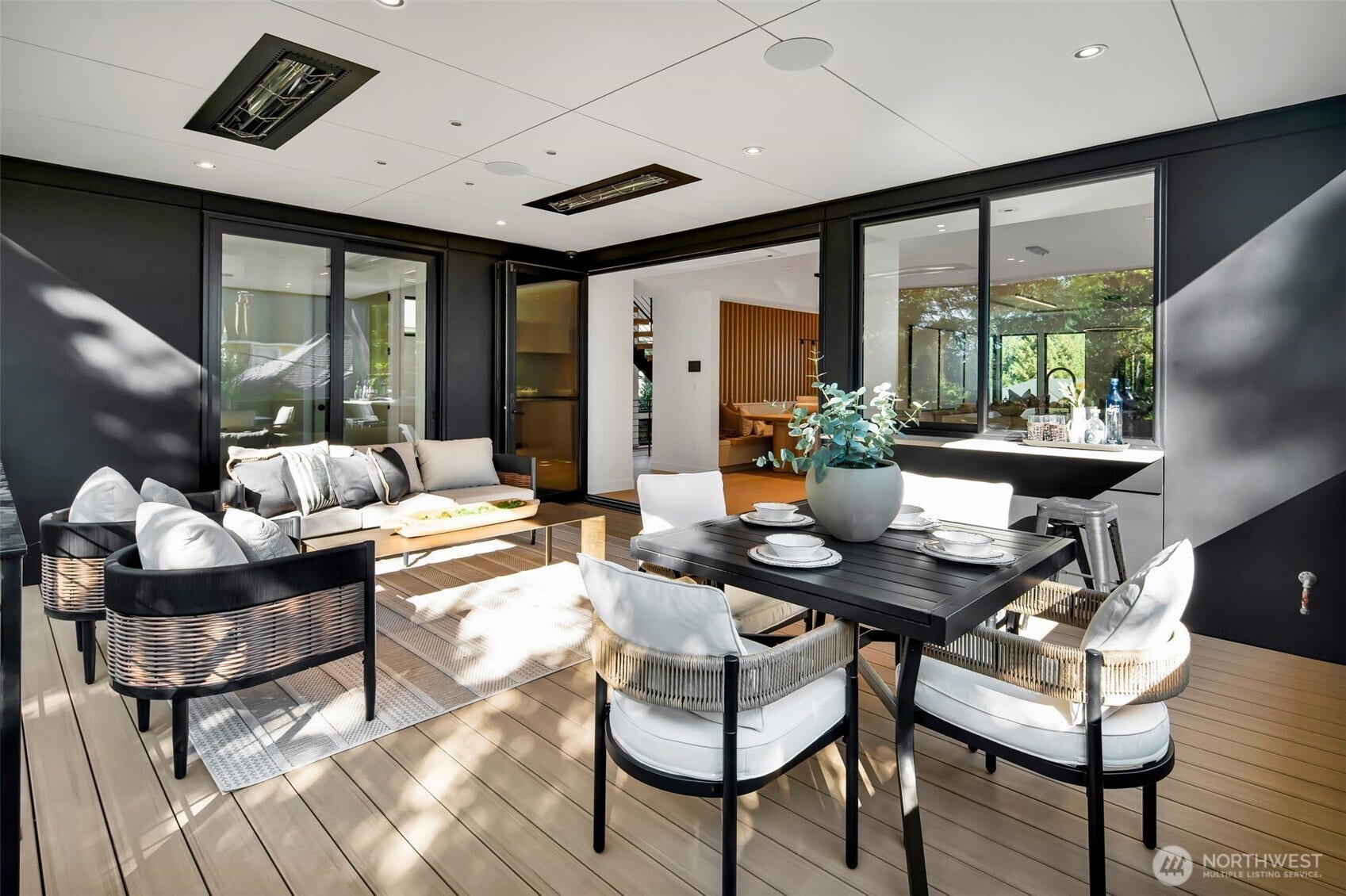 6021 Princeton Avenue NE, Seattle, WA 98115 Heated deck with built-in speakers and gas for BBQ's. The bi-fold doors and stylish pass-through counter for indoor-outdoor living.