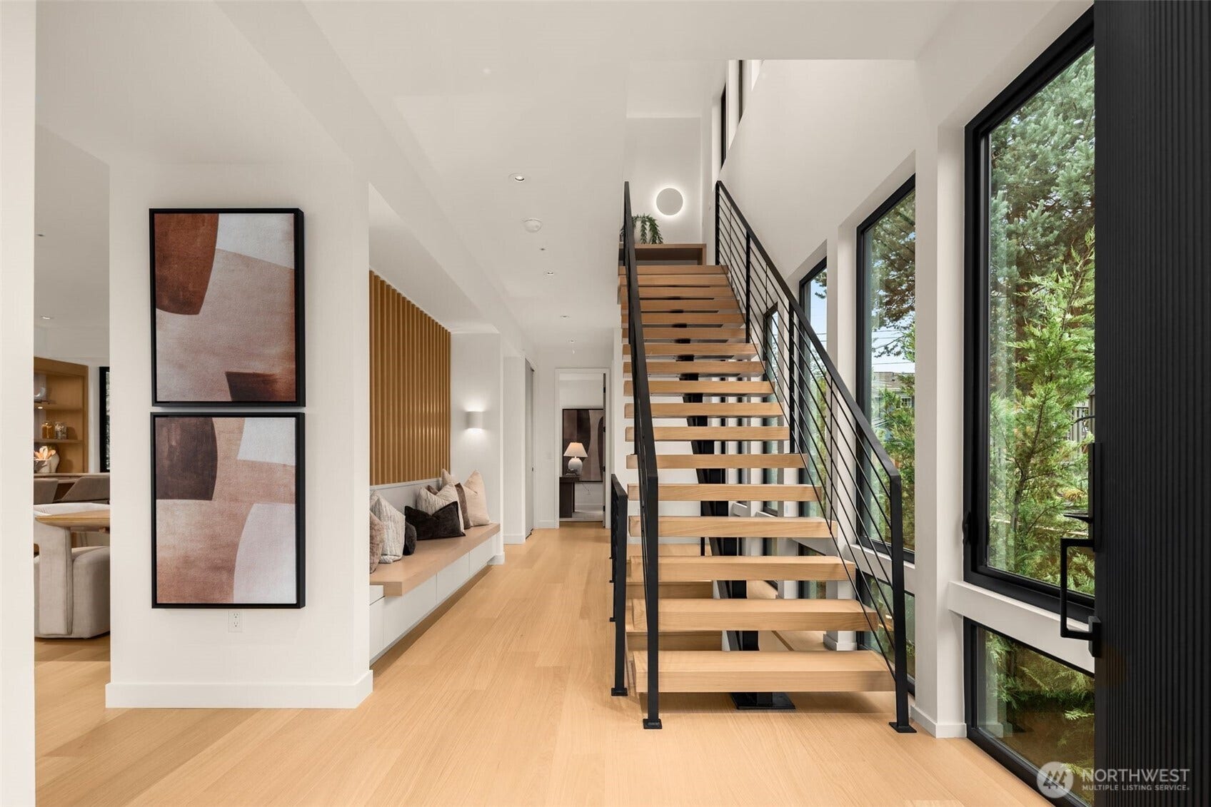 6021 Princeton Avenue NE, Seattle, WA 98115 The stunning floating staircase and custom entry bench with built-in storage create quite the first impression.