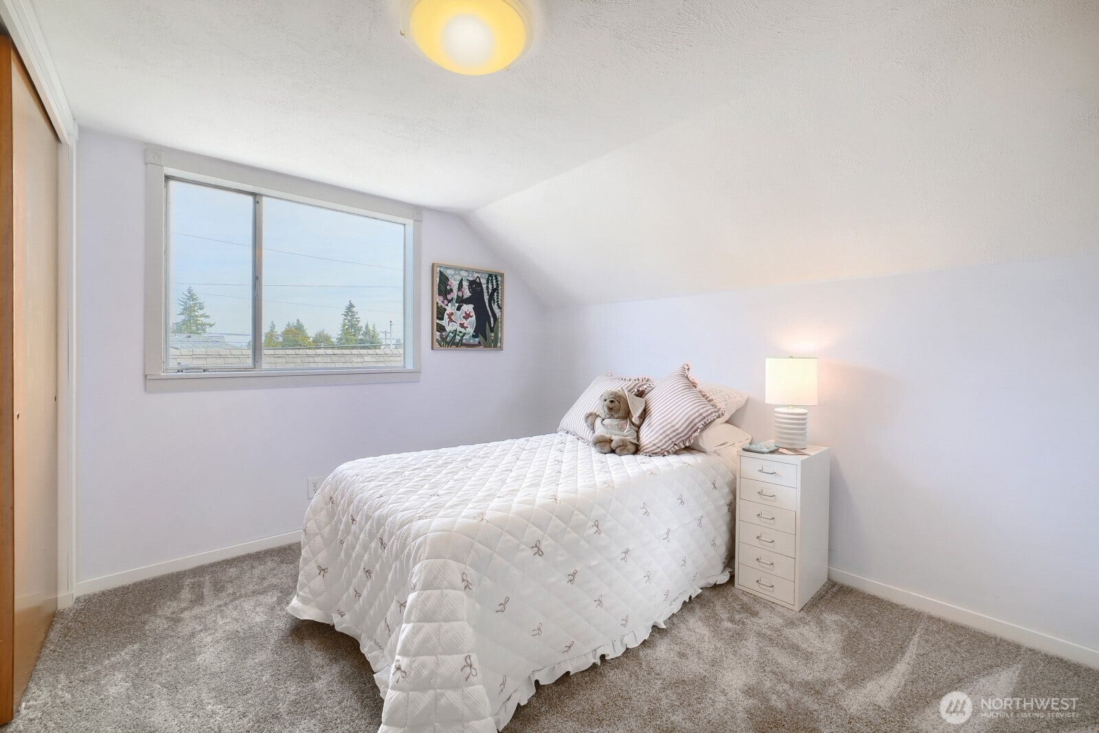 5013 N 33 Street, Tacoma, WA 98407 2nd bedroom upstairs featuring double closets, and an east facing window