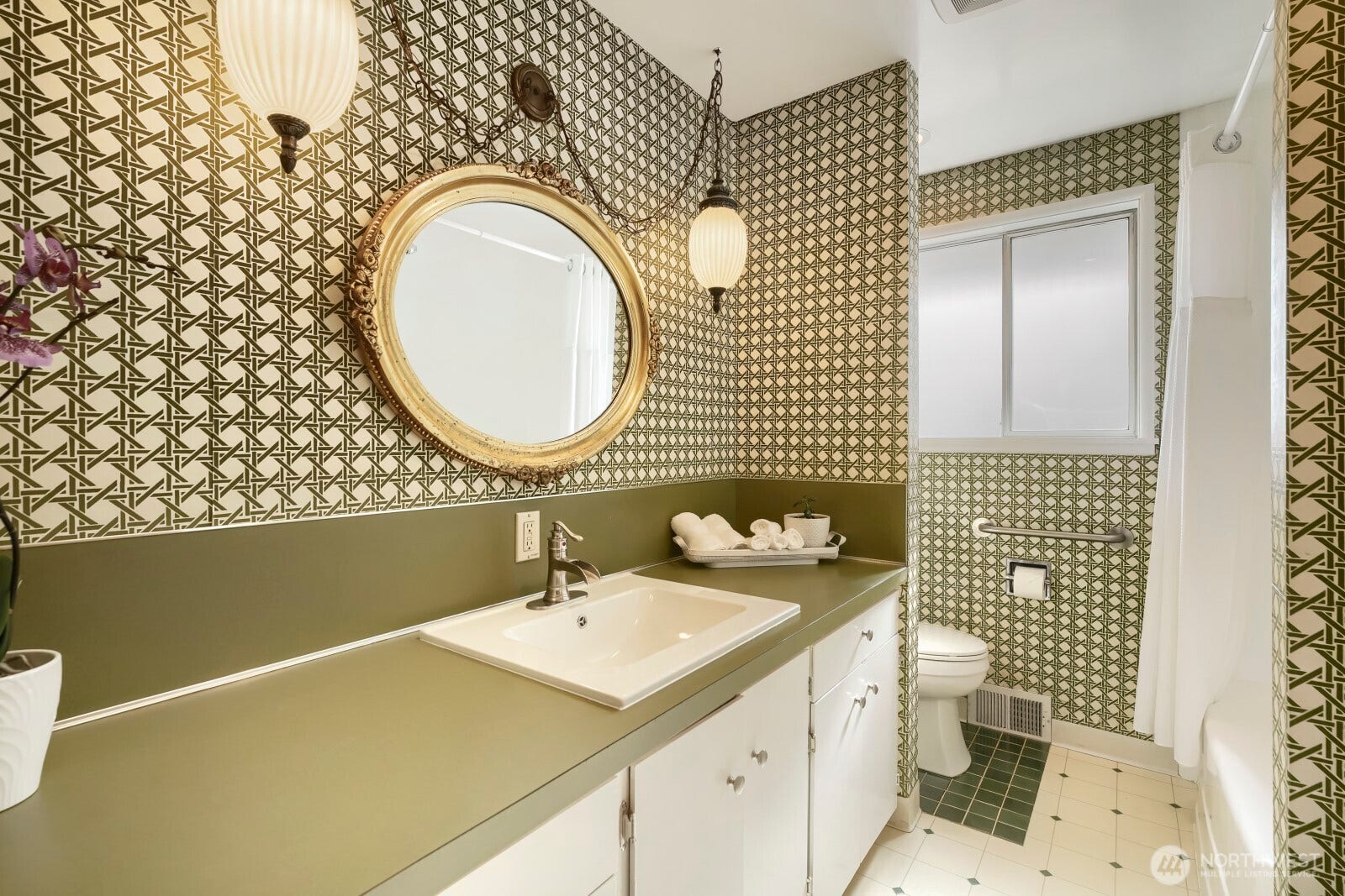 5013 N 33 Street, Tacoma, WA 98407 Fall in love with the fun fresh vibes of this main floor full updated bathroom with new sink, faucet, updated toilet and updates full shower surround and fixtures