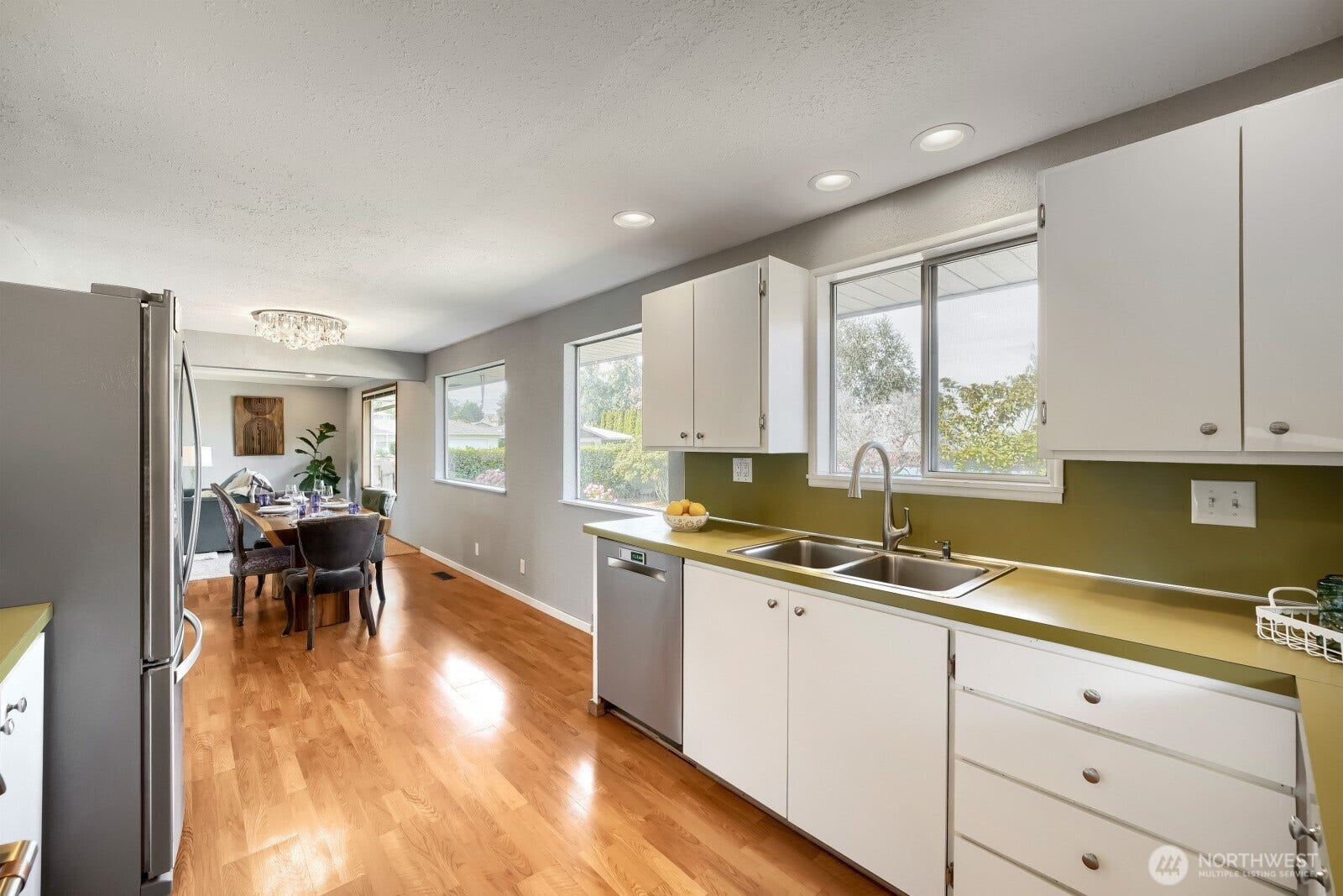 5013 N 33 Street, Tacoma, WA 98407 Looking west from garage door entry you can see how these oversize windows throughout the home really bring in the best PNW north facing light!