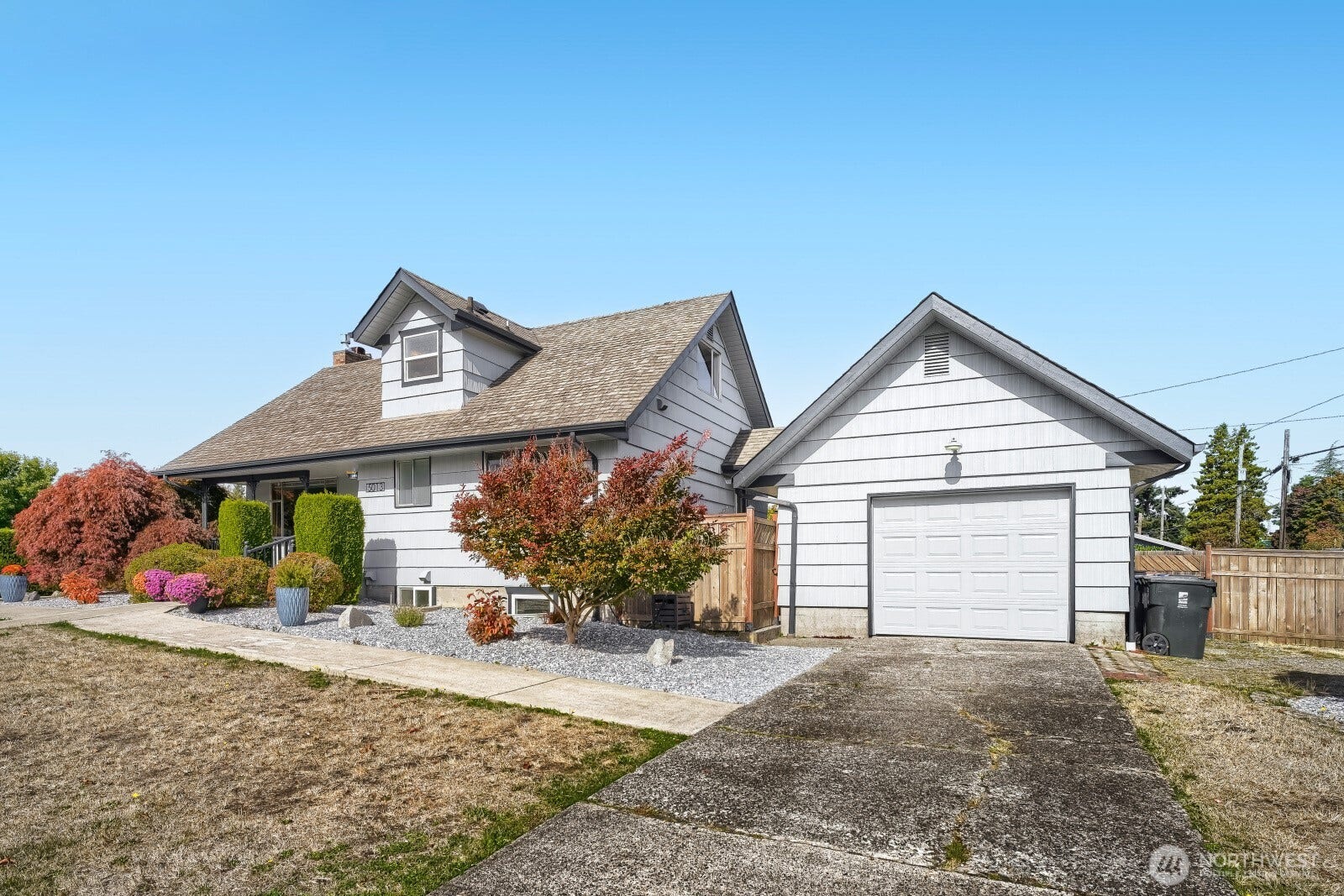 5013 N 33 Street, Tacoma, WA 98407 Detached garage with a covered breezeway to the main house, plus a fully fenced back yard, workshop, and plenty of parking for at least 3 additional vehicles off the street enhance value here.