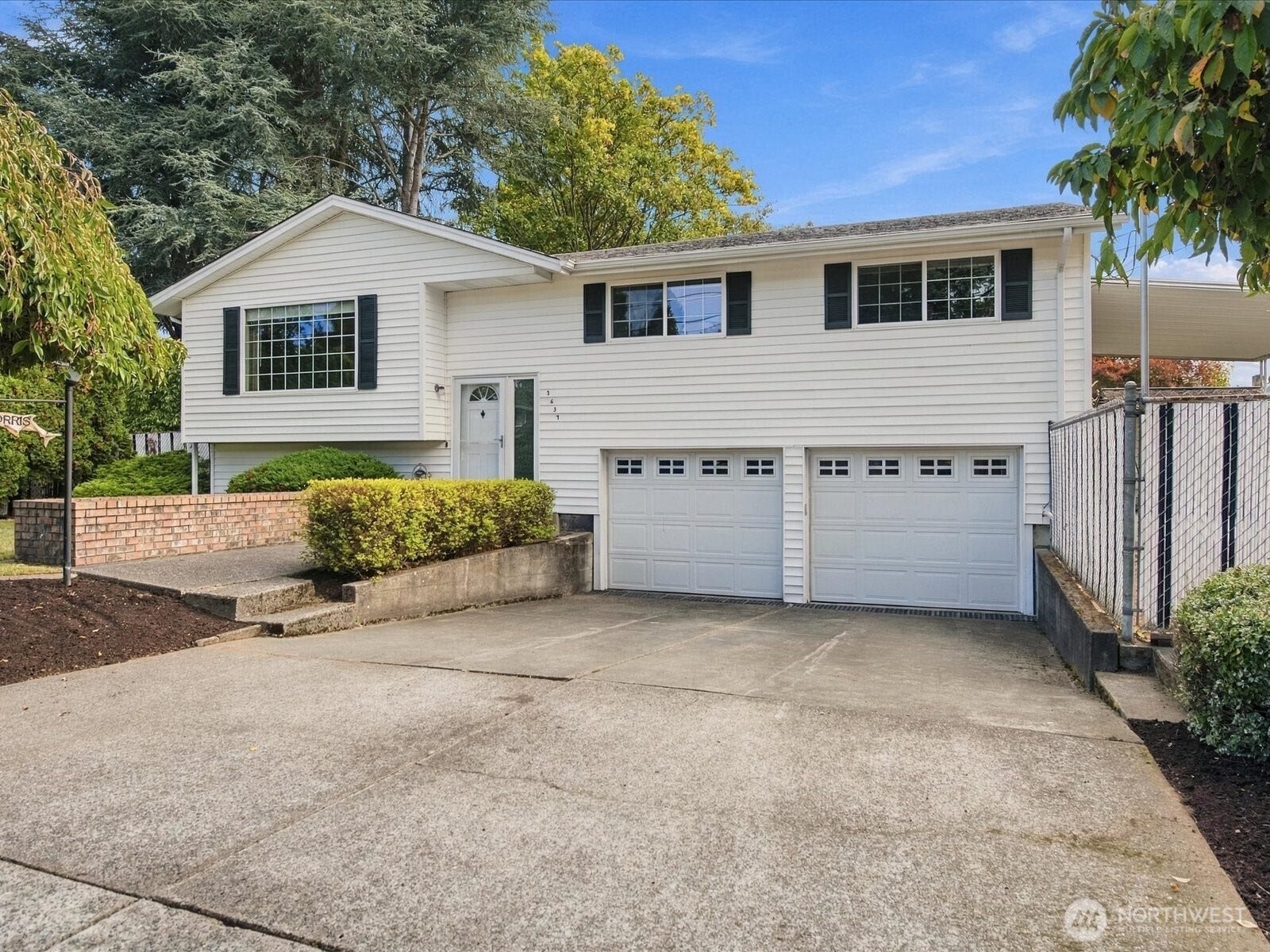 7637 Tacoma Avenue S, Tacoma, WA 98408 Double garage and easy access to the front. Use the built in planters to create a stunning entry.