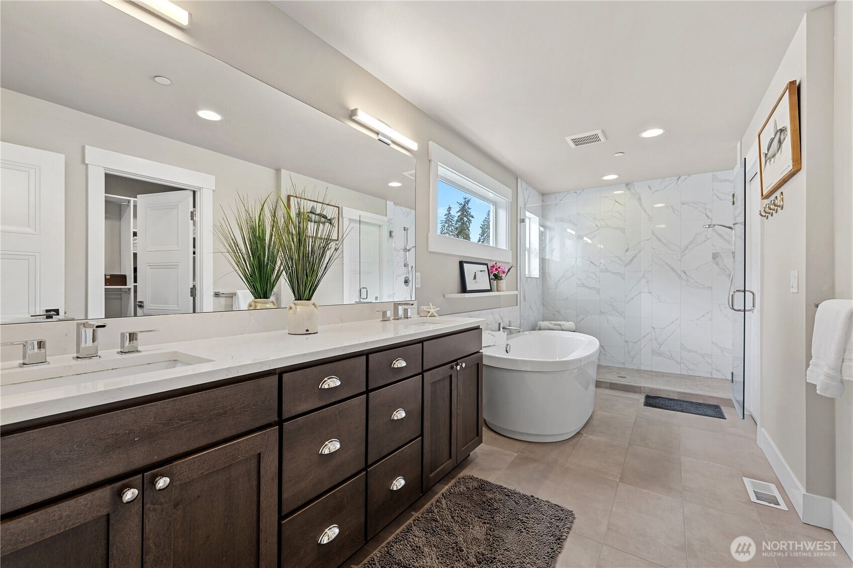 Primary bathroom with free standing tub, dual sinks and huge shower.