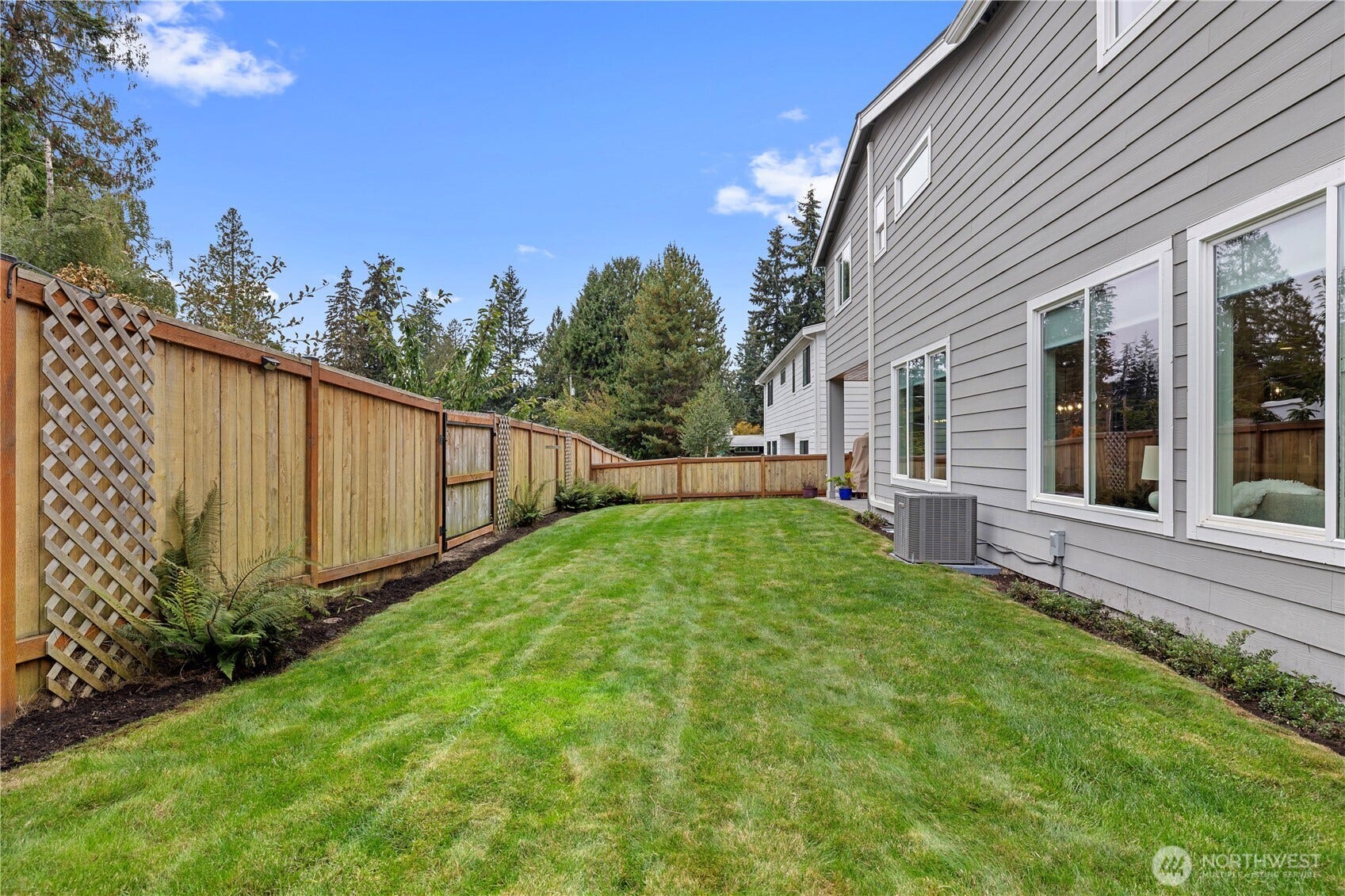 Fenced Side yard showing the Gate to additional parking.