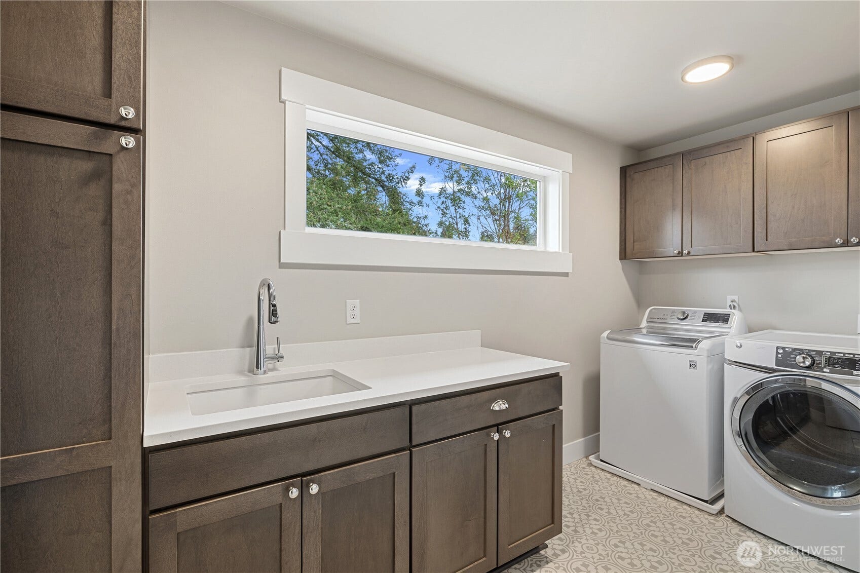 Upper Level Laundry room with Utility sink and Storage!