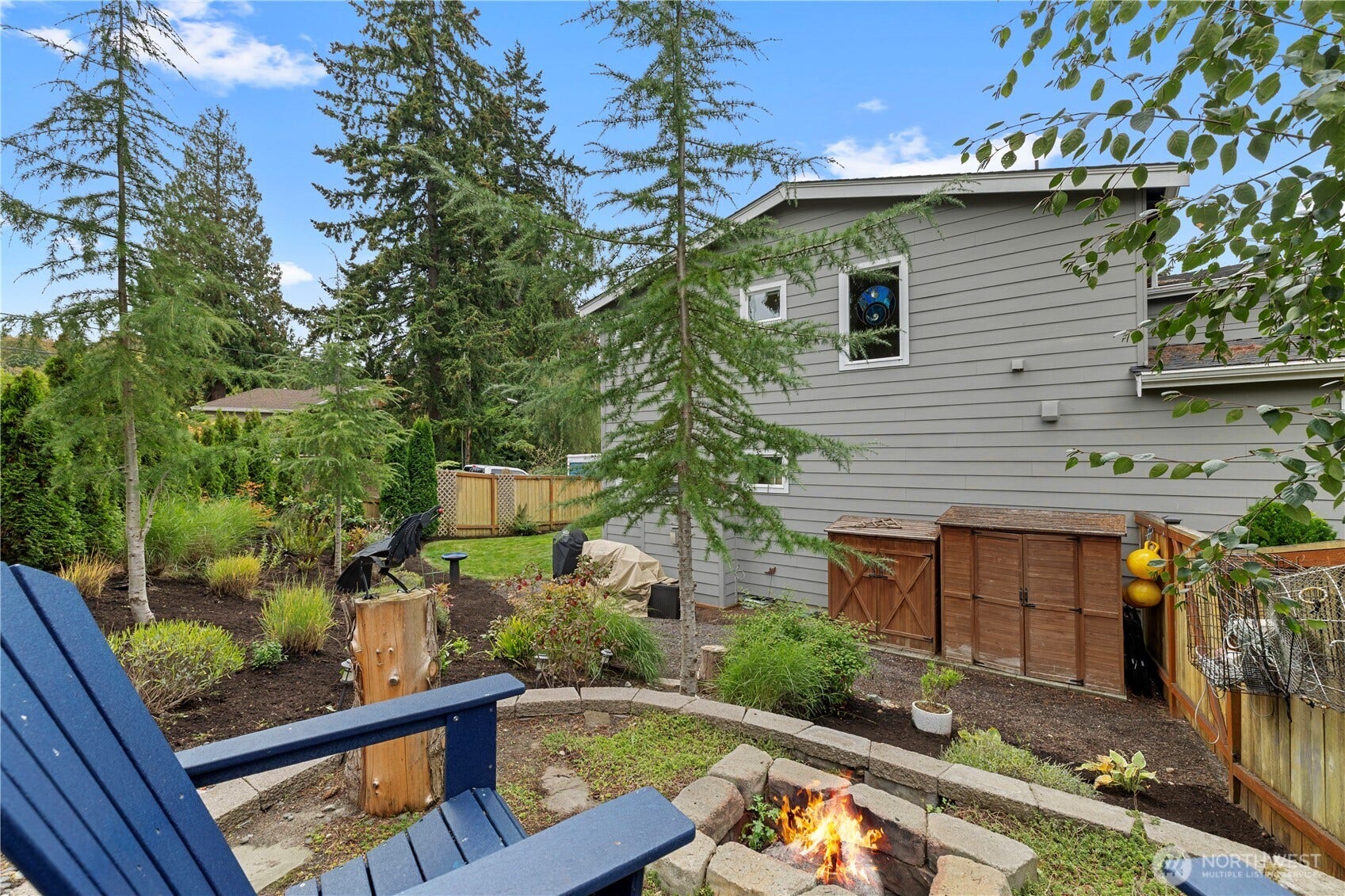 Side yard with firepit and storage