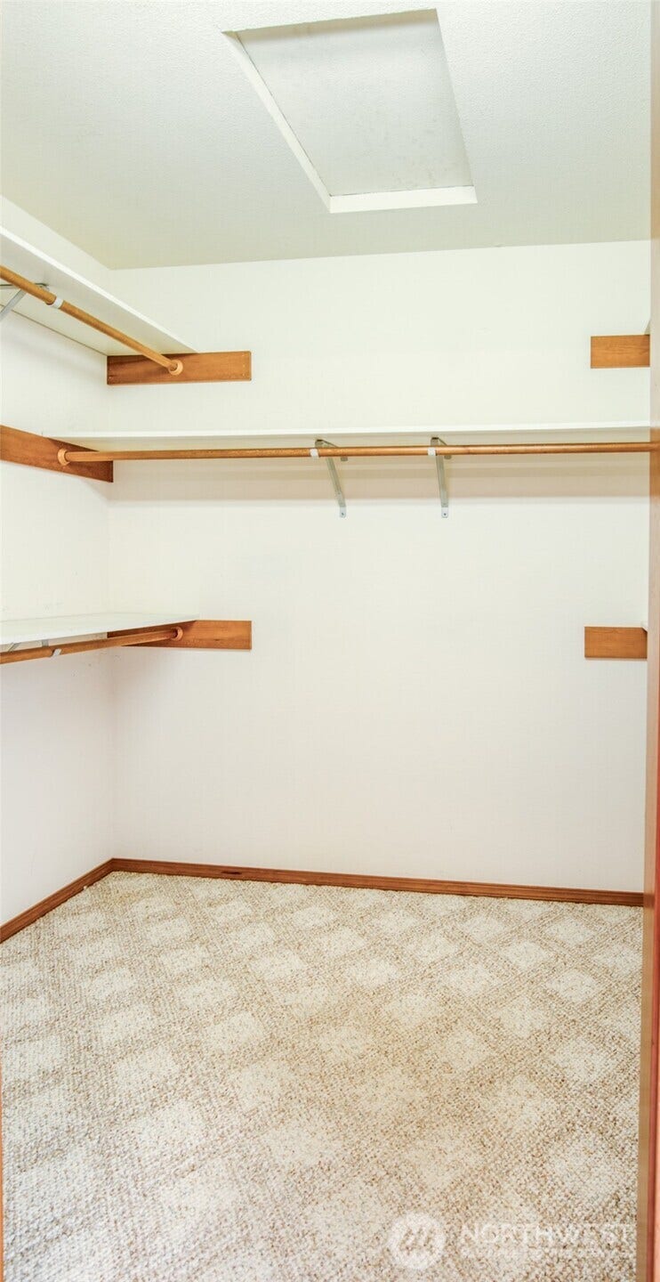 Walk in closet with room for all your clothes and still more room for storage