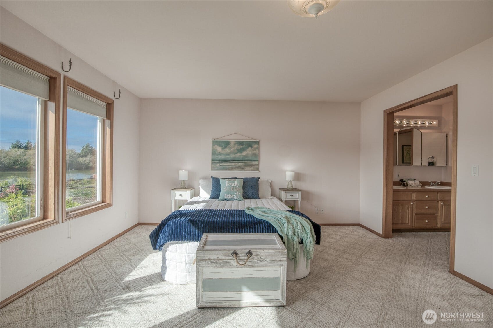 Large primary suite with views of Duck Lake