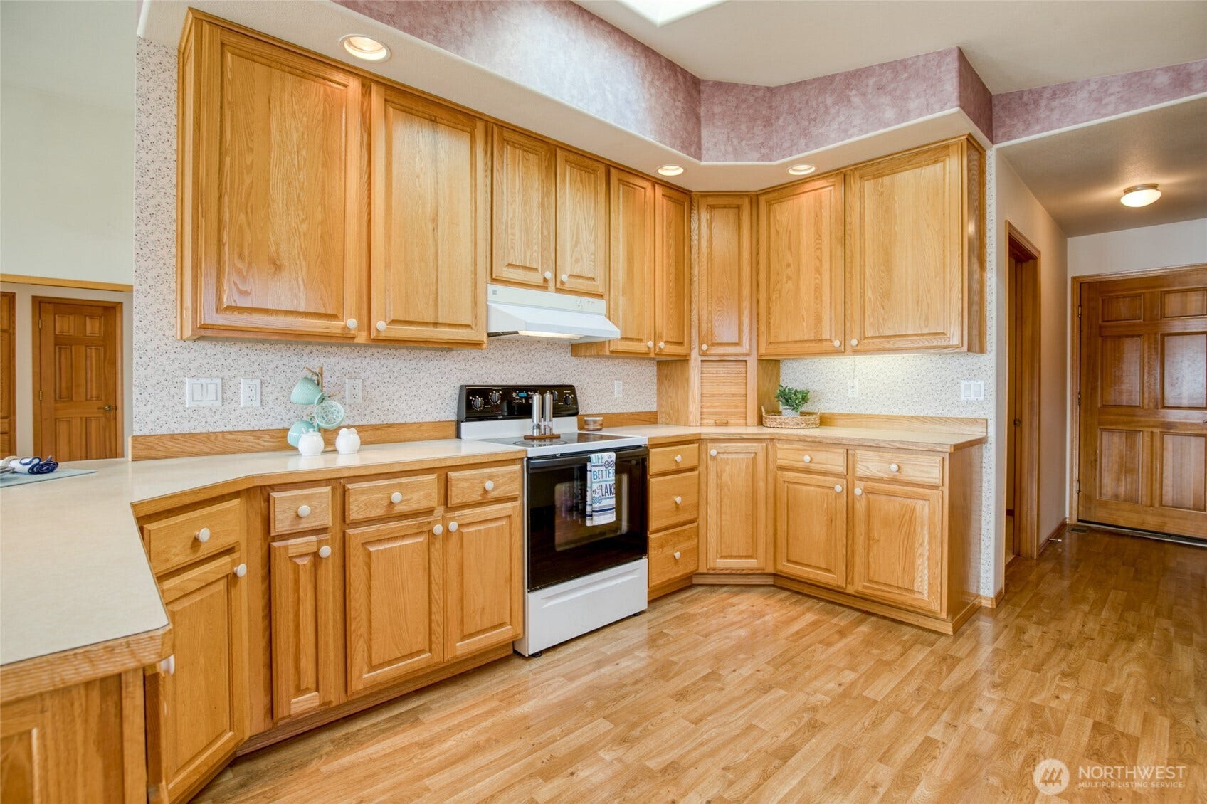 Large chefs' kitchen with original wood cabinets