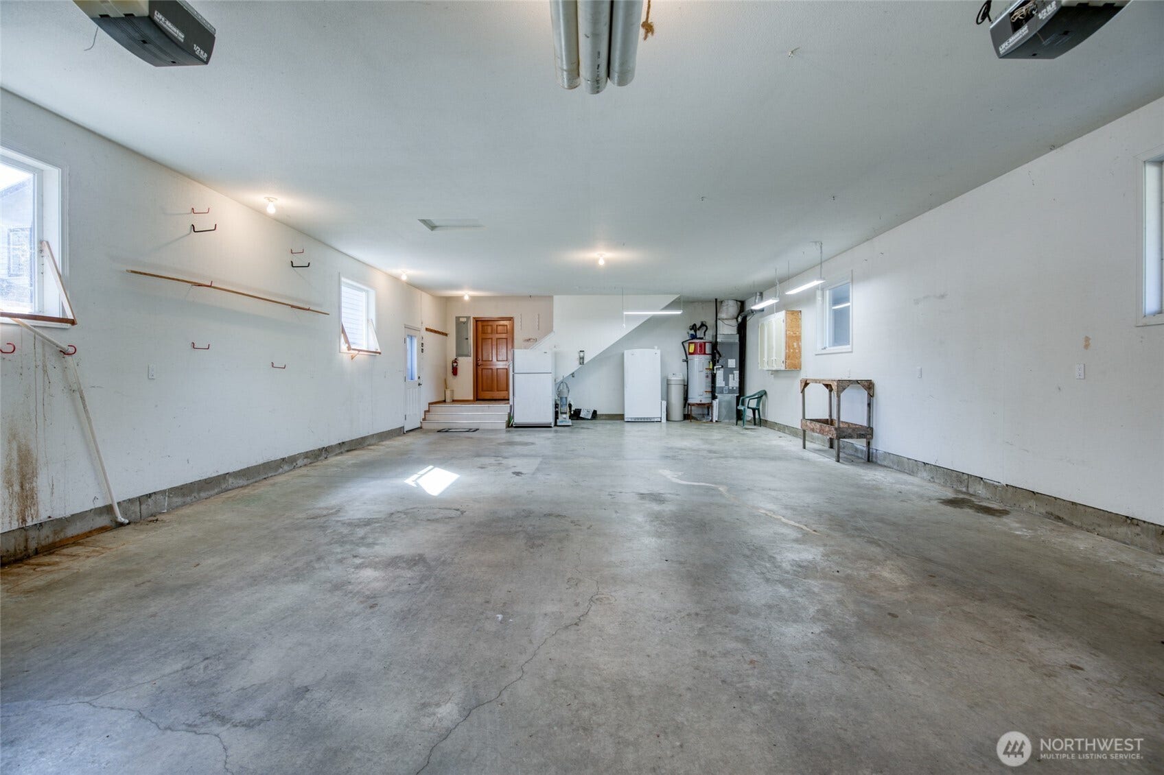 Over deep garage with workspace