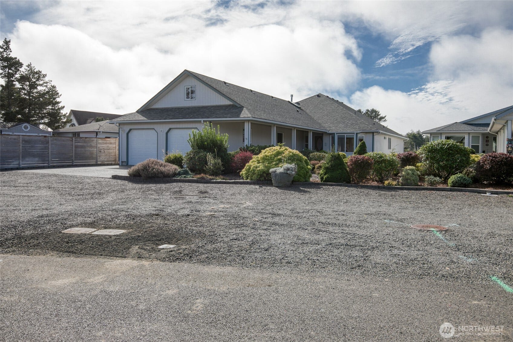 Mature landscaping and large driveway parking for guests