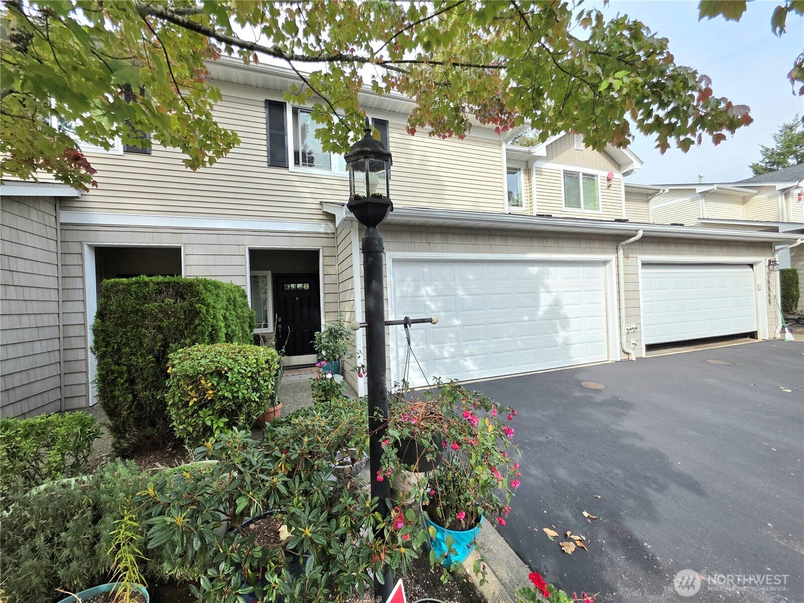 18866 108th Lane SE, Renton, WA 98055 2-car garage plus driveway parking adds convenience. Ample guest parking also available within walking distance.