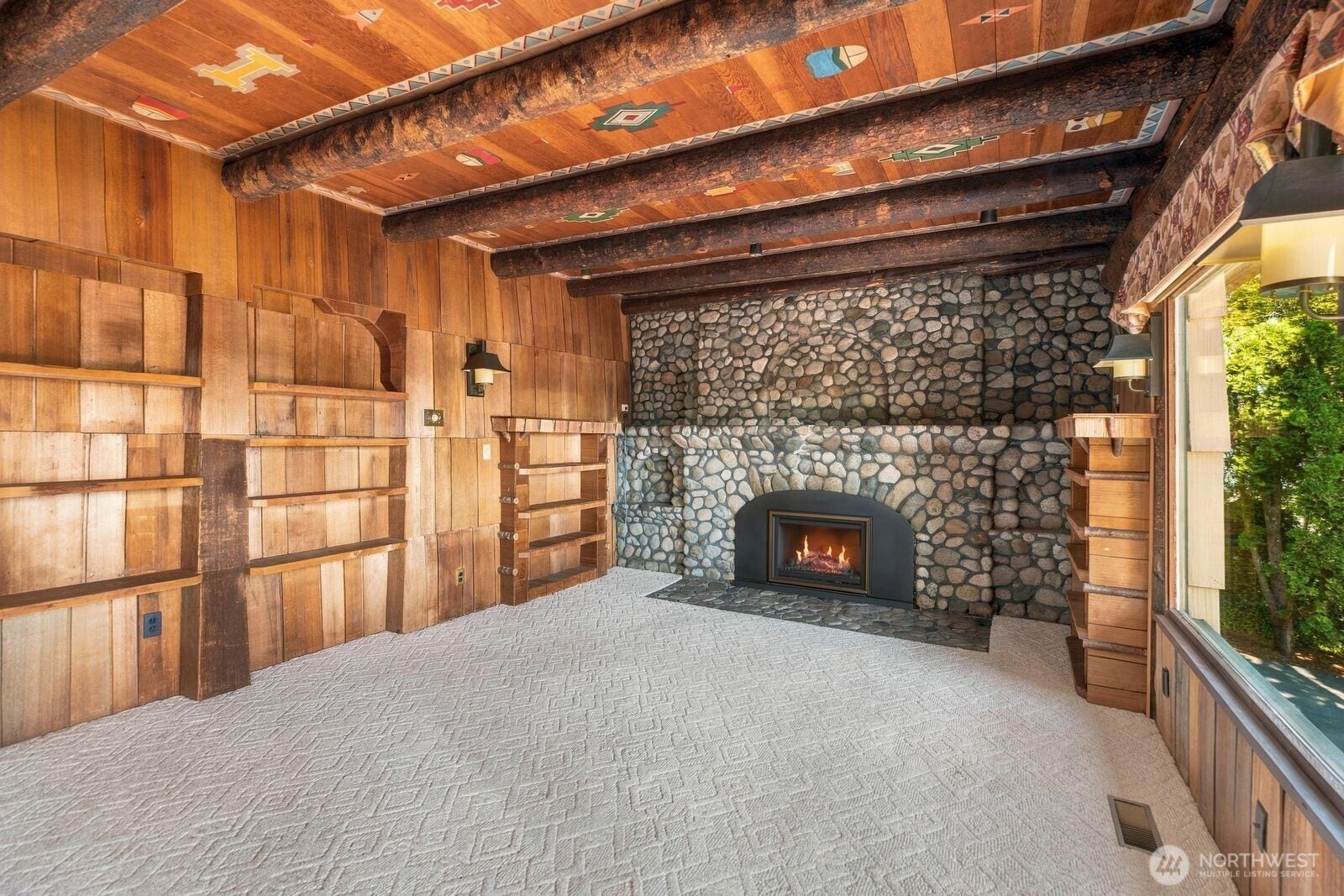 New River Rock Gas Fireplace in Living Room off of Dining.