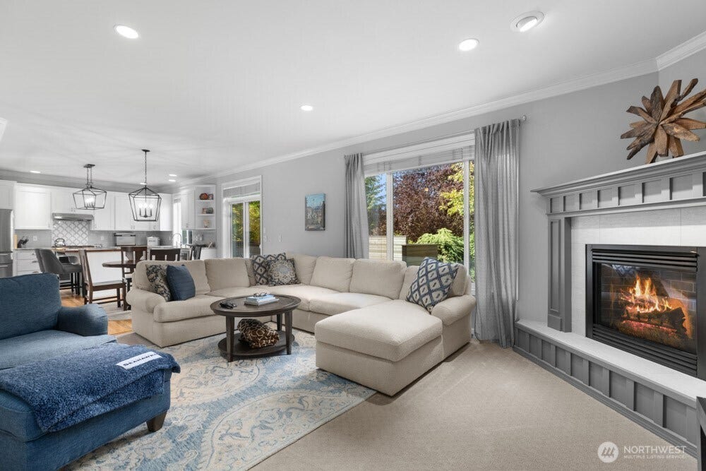 The open-concept kitchen flows seamlessly into the family room, creating an inviting space to gather and relax.