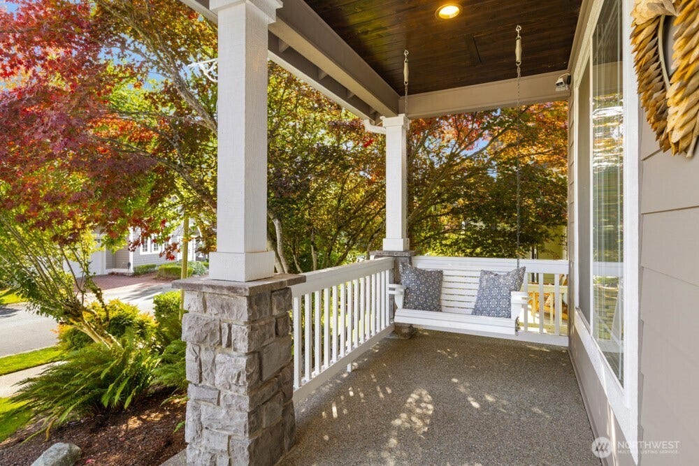 Does it get any more inviting than a front porch swing surrounded by gorgeous fall color.