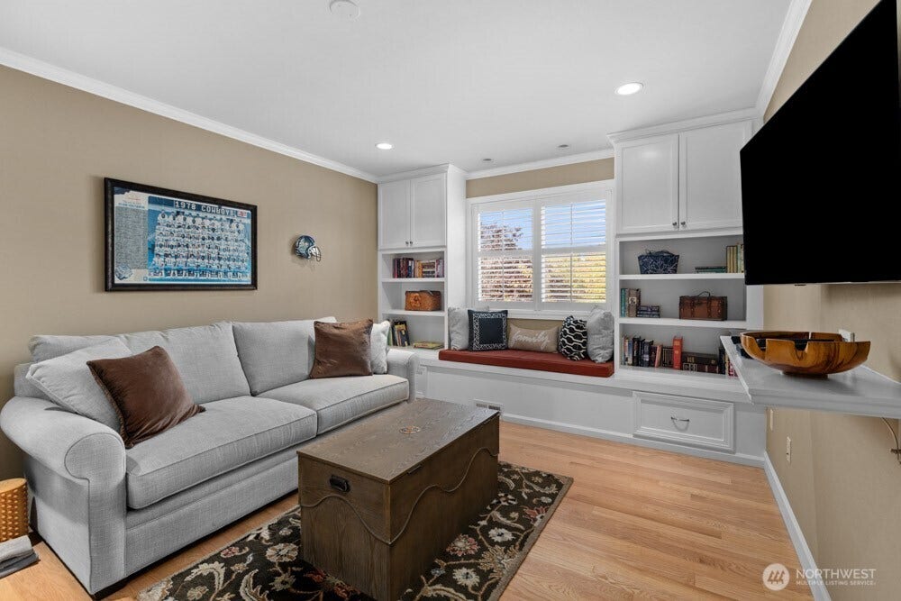 Beautiful built-ins and a charming window seat add both character and function to this flexible space.