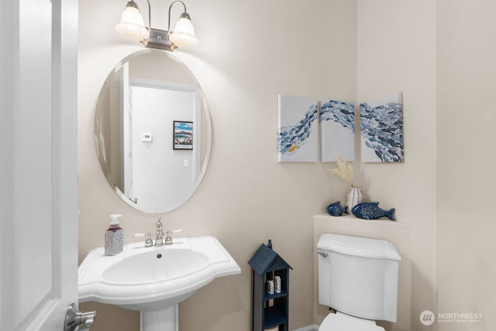 Bright, clean and welcoming, the powder bath is perfectly placed for guests.