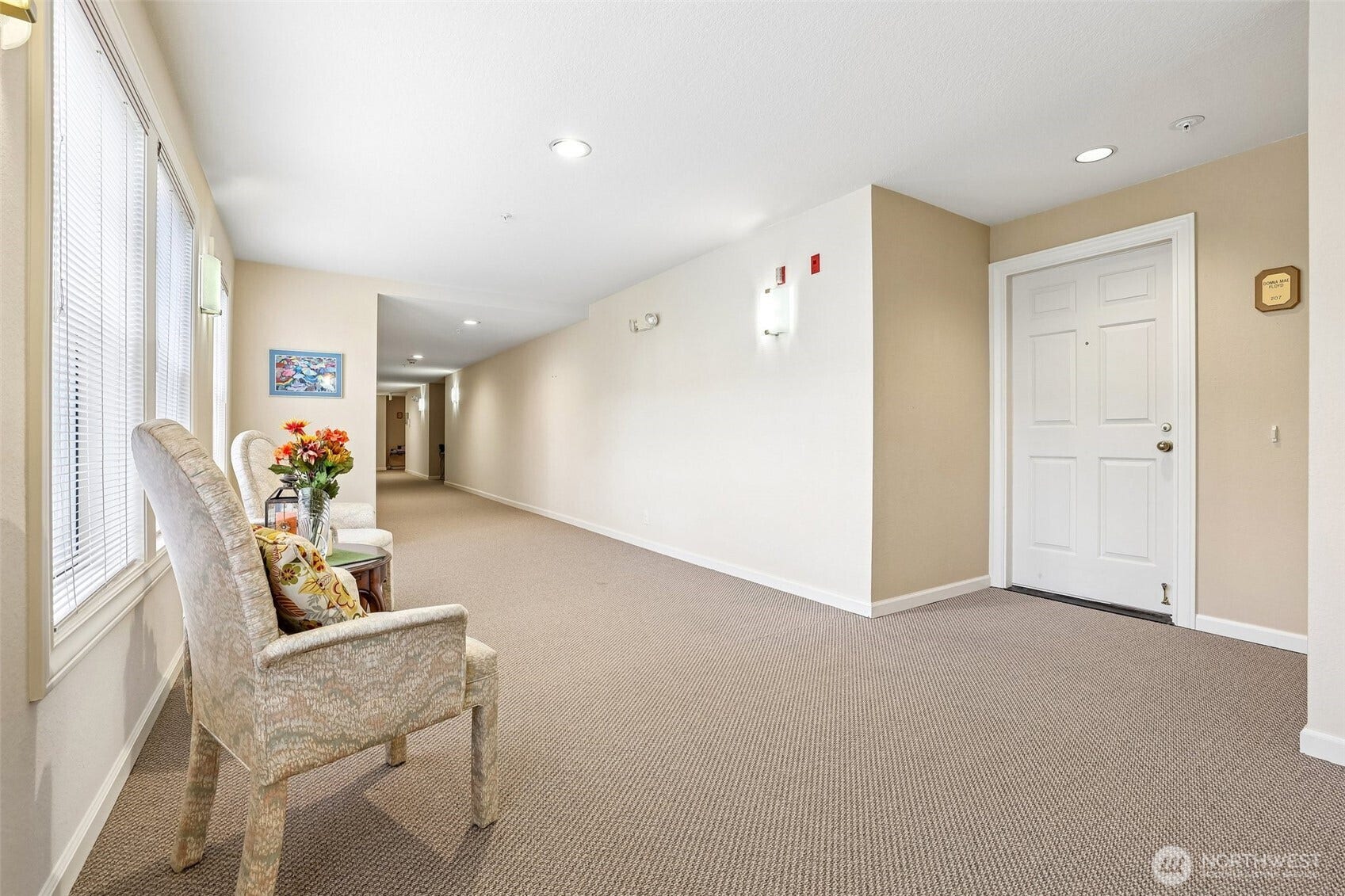 Hallway with cozy sitting area just outside #207