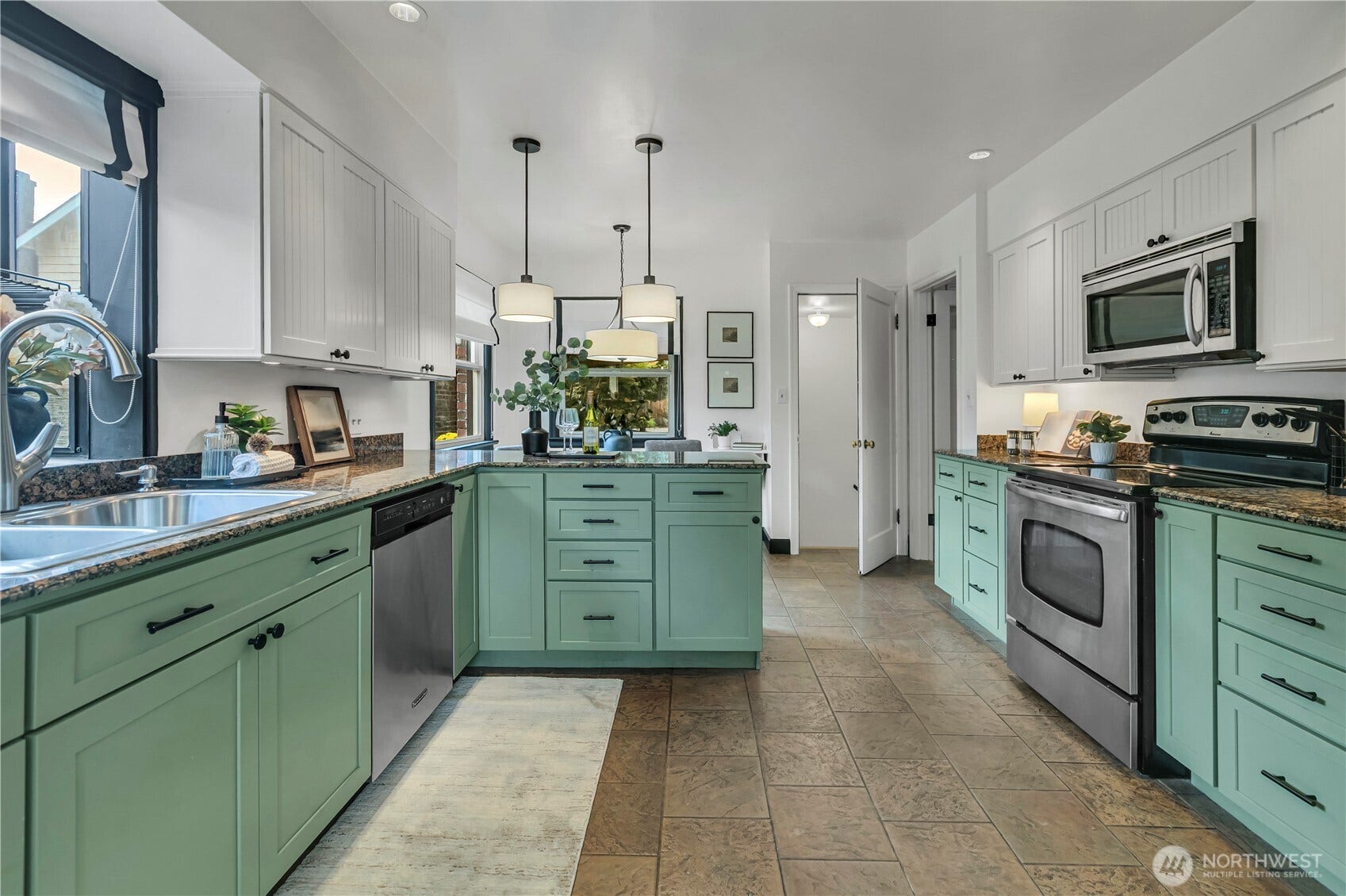 1910 N Union Avenue, Tacoma, WA 98406 Remodeled kitchen with new shaker style cabinety, slab granite counters & a drop-in sink.