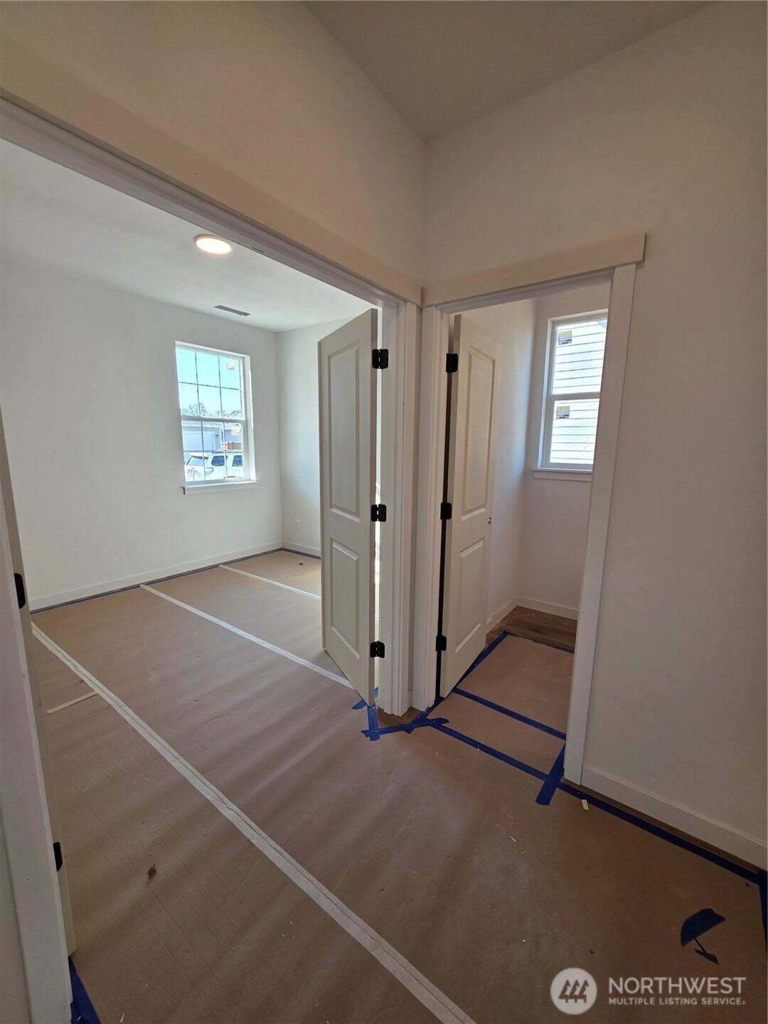 Den at the entry w/ half bath