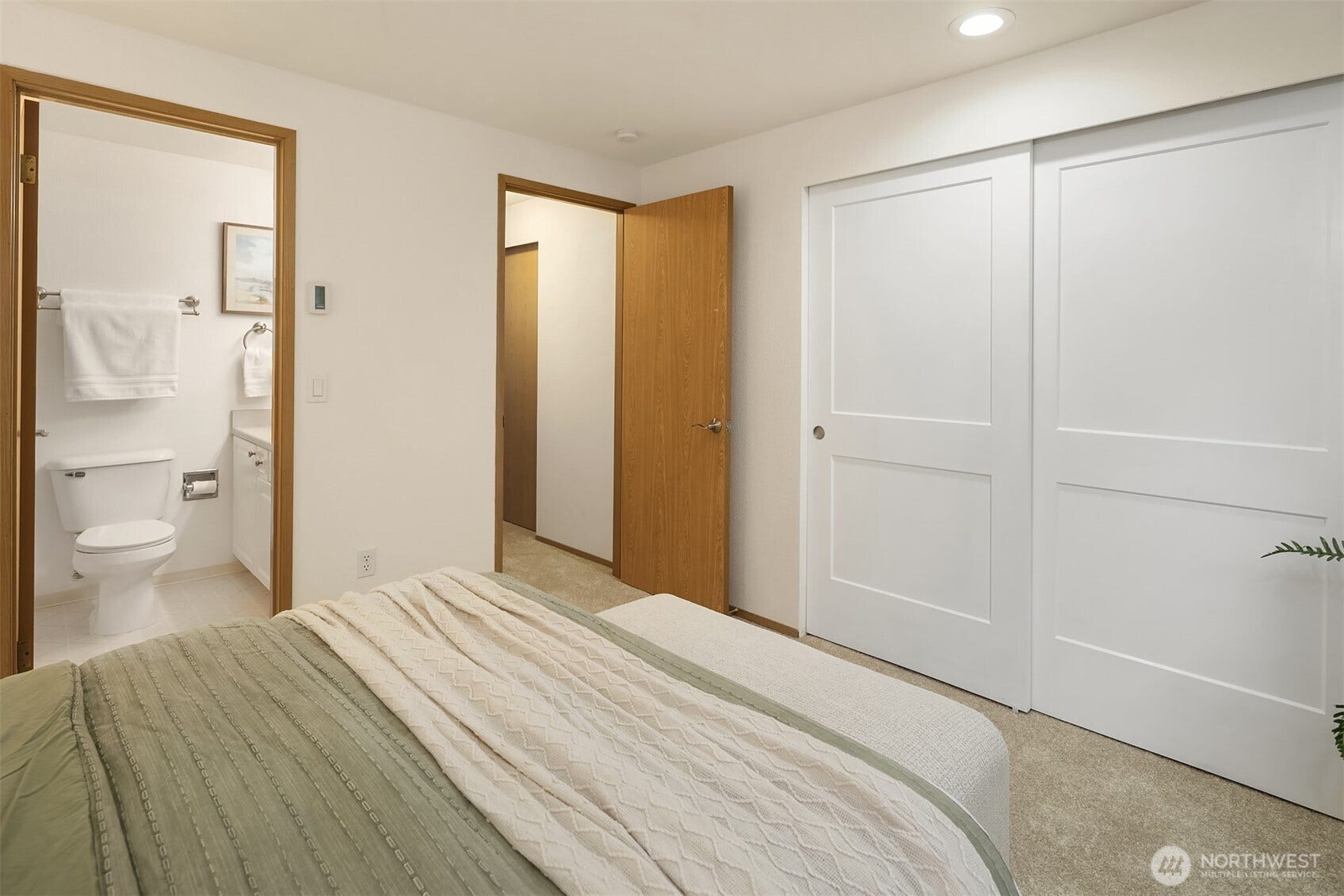 Attached full bathroom and full size closet w/ new white doors.