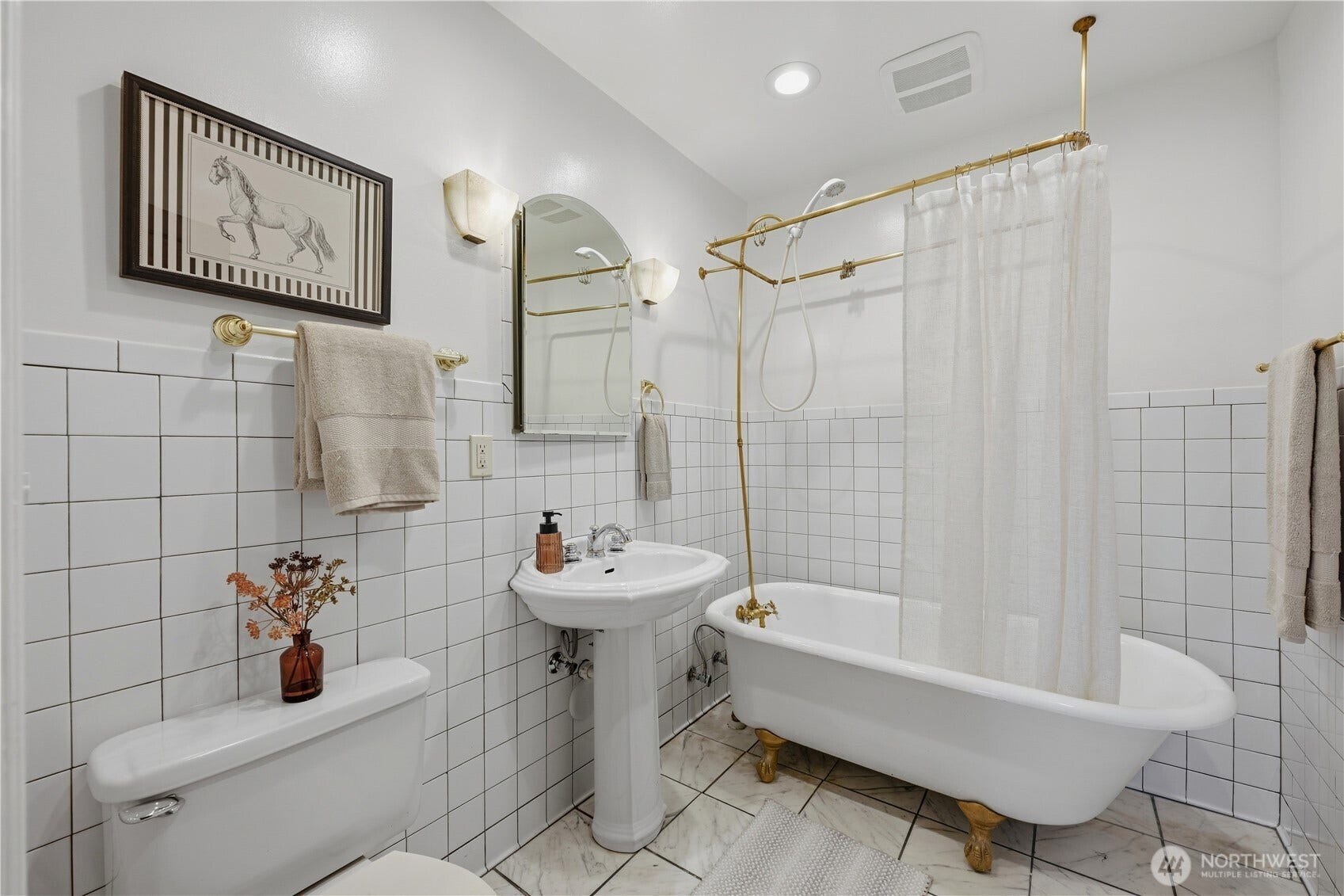 7 Harrison Street, #2, Seattle, WA 98109 Lovely tile bathroom with pedestal sink and check out the charming clawfoot tub!
