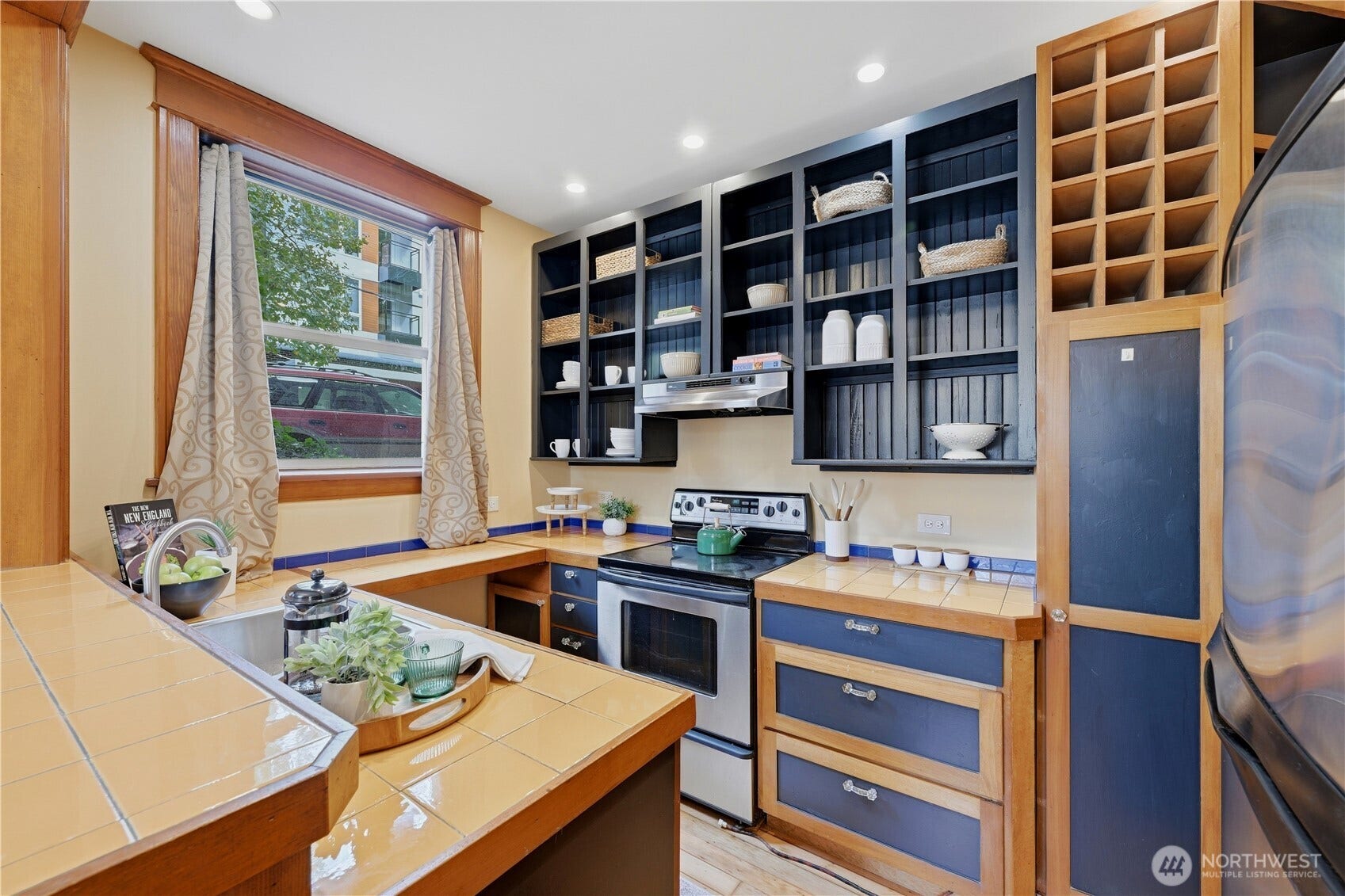 7 Harrison Street, #2, Seattle, WA 98109 Wonderful kitchen with plenty of cabinet storage and countertop to prepare and cook. Do you see the wine rack?