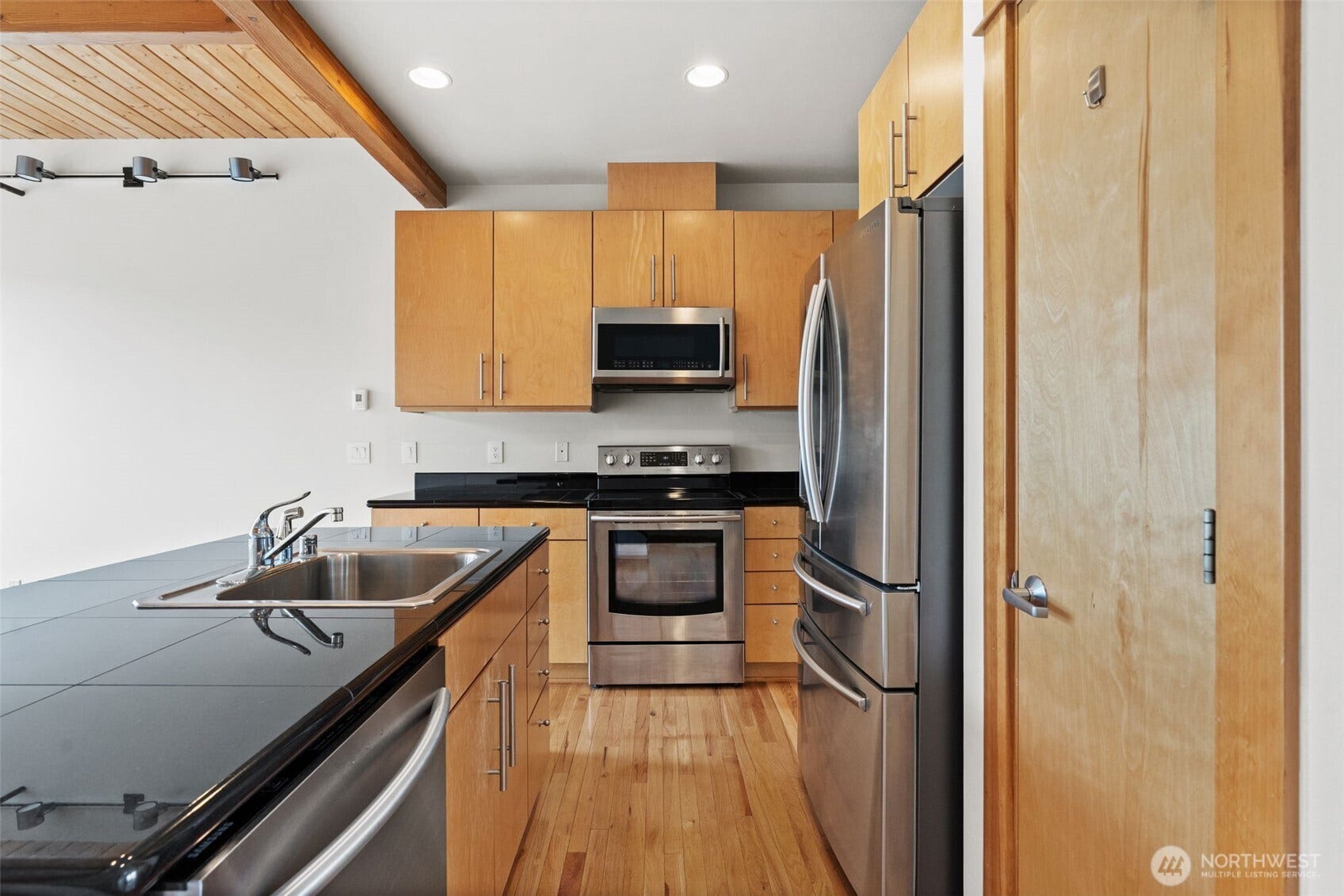 2520 Jefferson Avenue, #C, Tacoma, WA 98402 Kitchen island. Granite countertops. Pantry on right.
