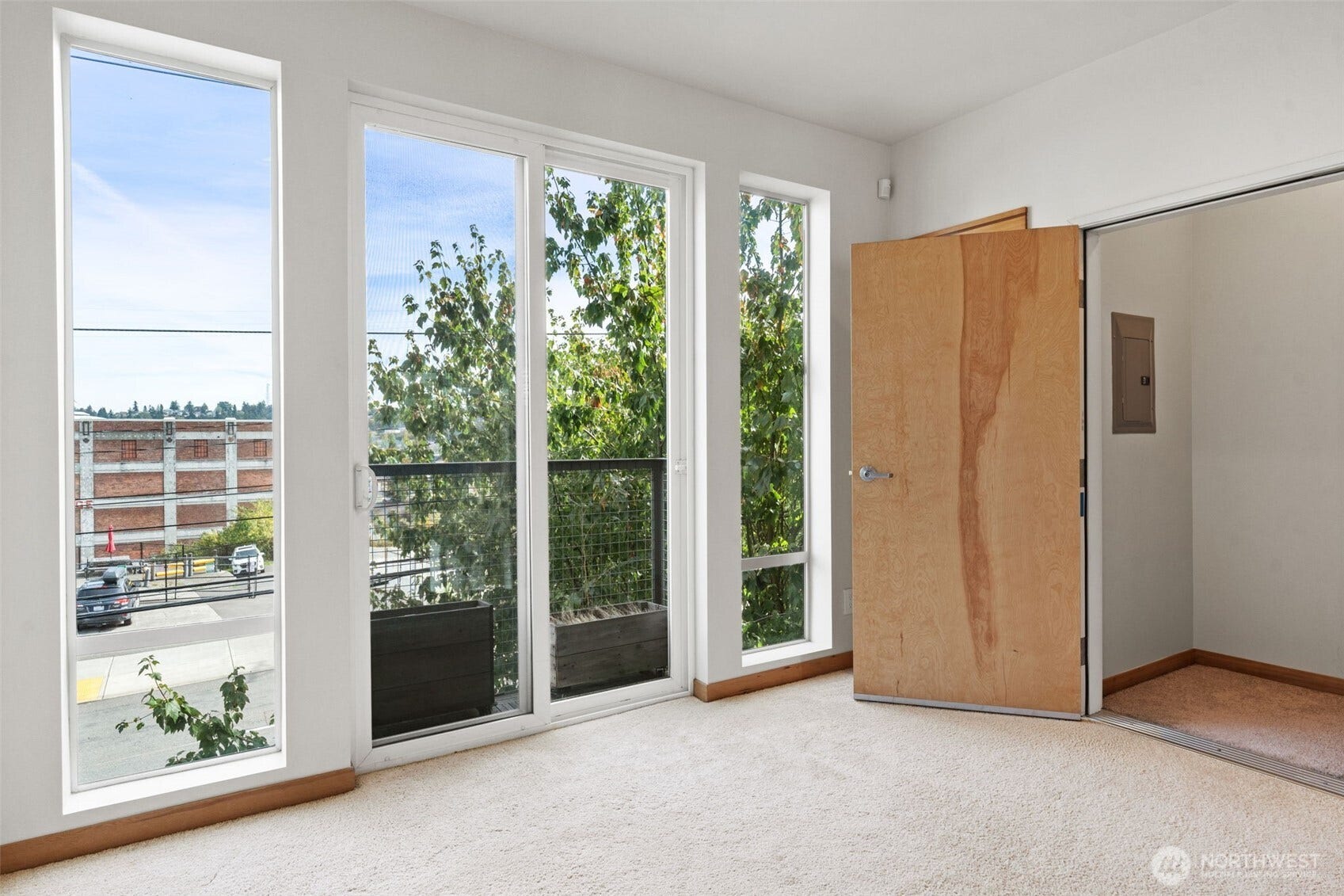 2520 Jefferson Avenue, #C, Tacoma, WA 98402 Main living area; Dining room with wall-to-wall windows and balcony.
