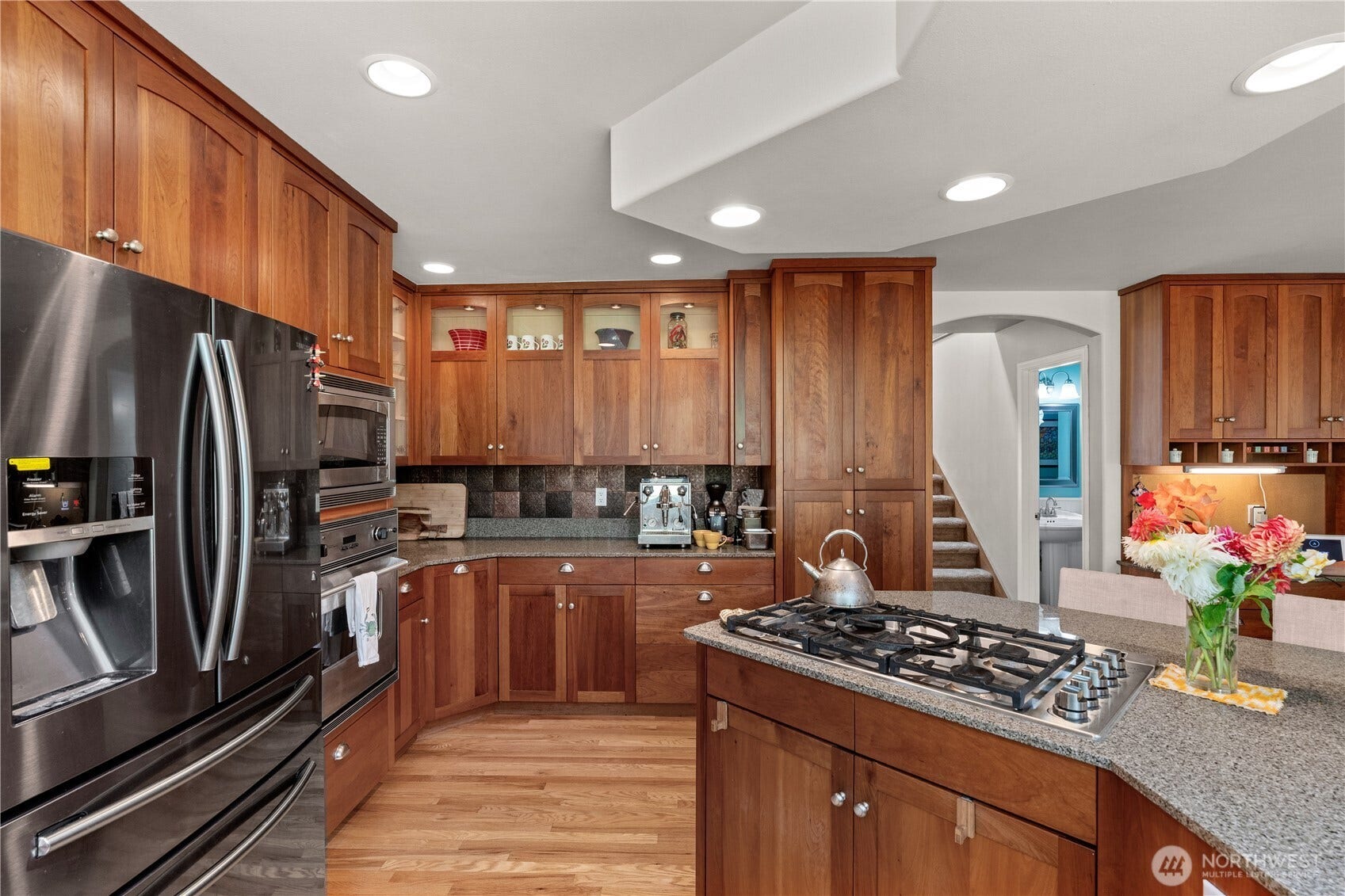 23924 SE 186th Street, Maple Valley, WA 98038 Stainless appliances, lighted glass cabinets, soft close drawers and cabinetry. This is ABSOLUTELY the best kitchen. Warm and efficient.