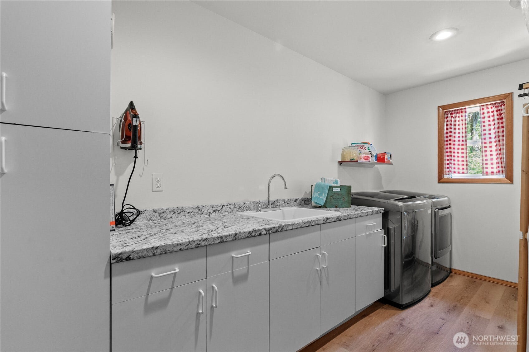23924 SE 186th Street, Maple Valley, WA 98038 New flooring, counters, faucet and paint in this spacious laundry room.