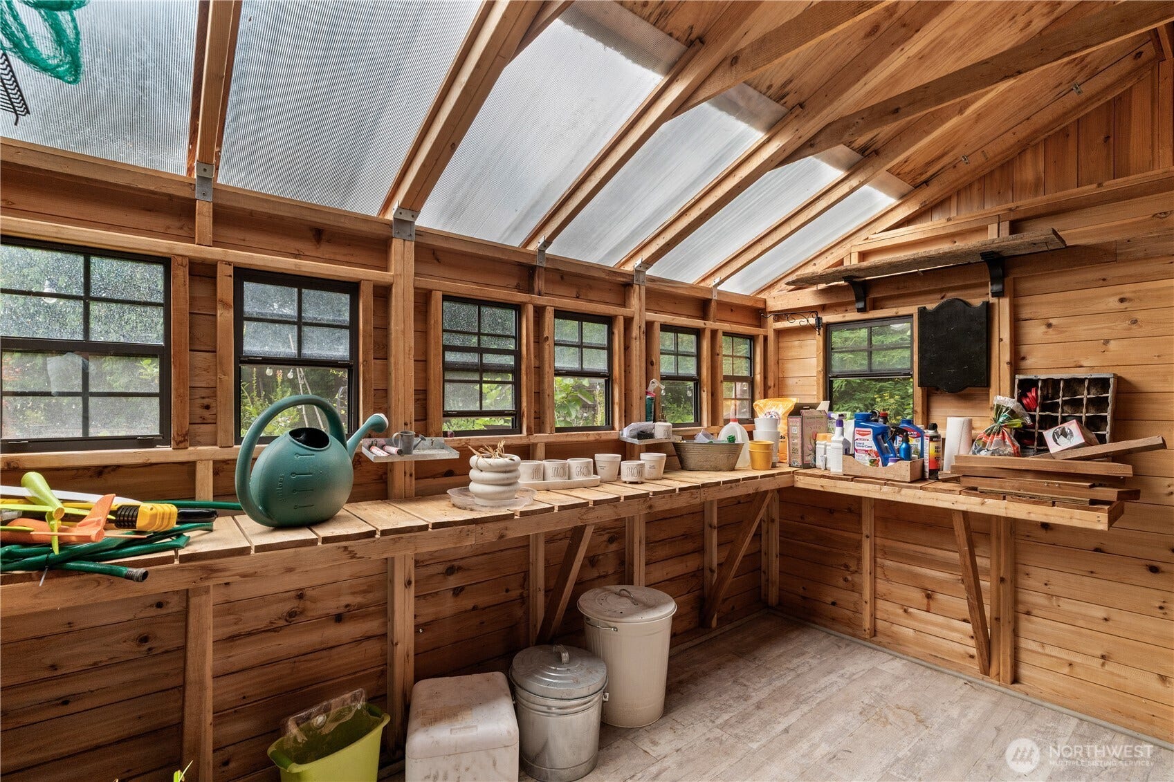 23924 SE 186th Street, Maple Valley, WA 98038 Terrific "L" shaped work space. Ceiling windows and side/front & back windows. Dont forget the garden boxes attached! Strawberries are in there now.