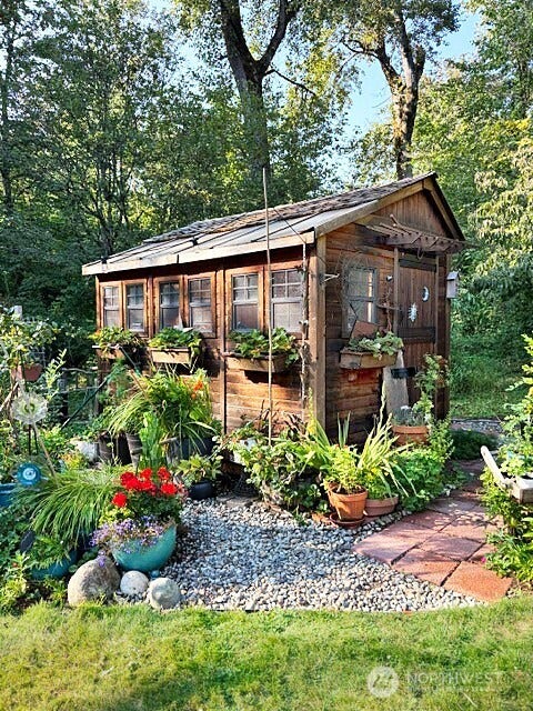 23924 SE 186th Street, Maple Valley, WA 98038 This sweet little garden shed is a special retreat. Enjoy a naturally warm environment while preparing your seedlings to grow!