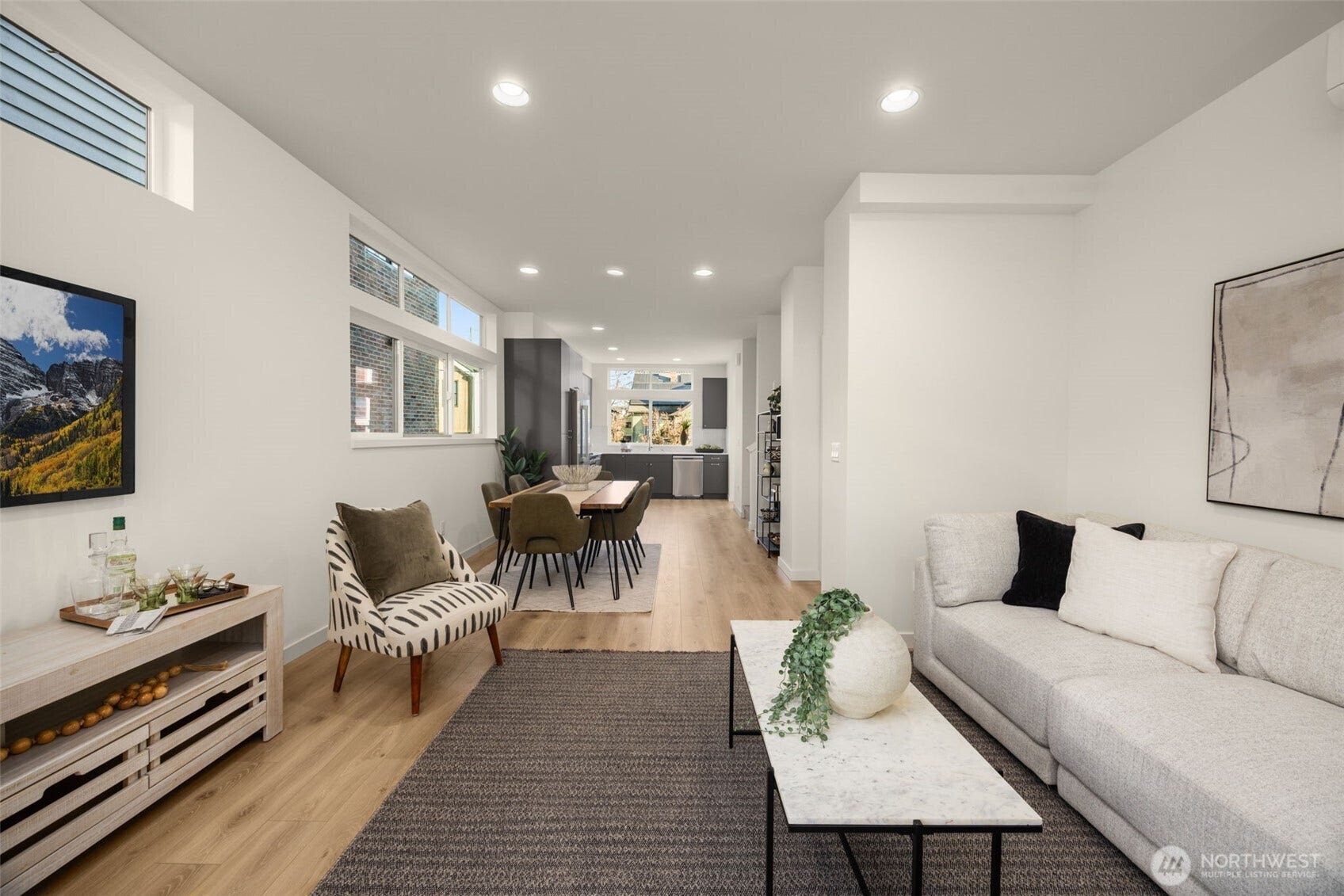Recessed lighting and wide-plank floors throughout