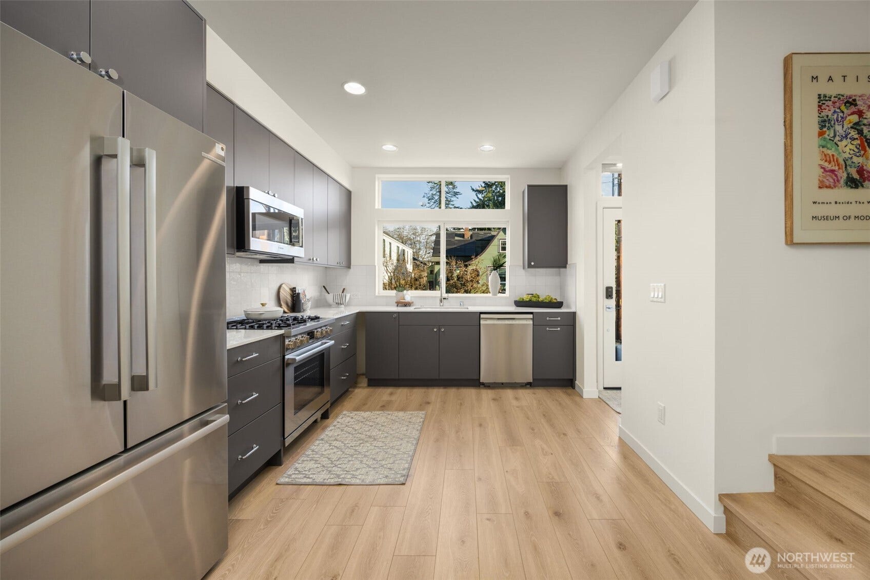 Kitchen with stainless appliances and sleek modern cabinetry