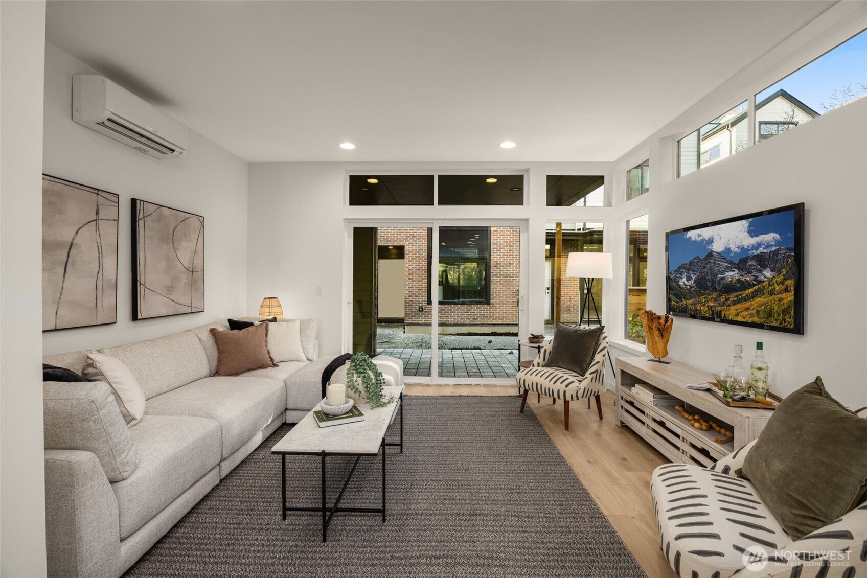 Floor-to-ceiling glass and clerestory windows bring in light all day